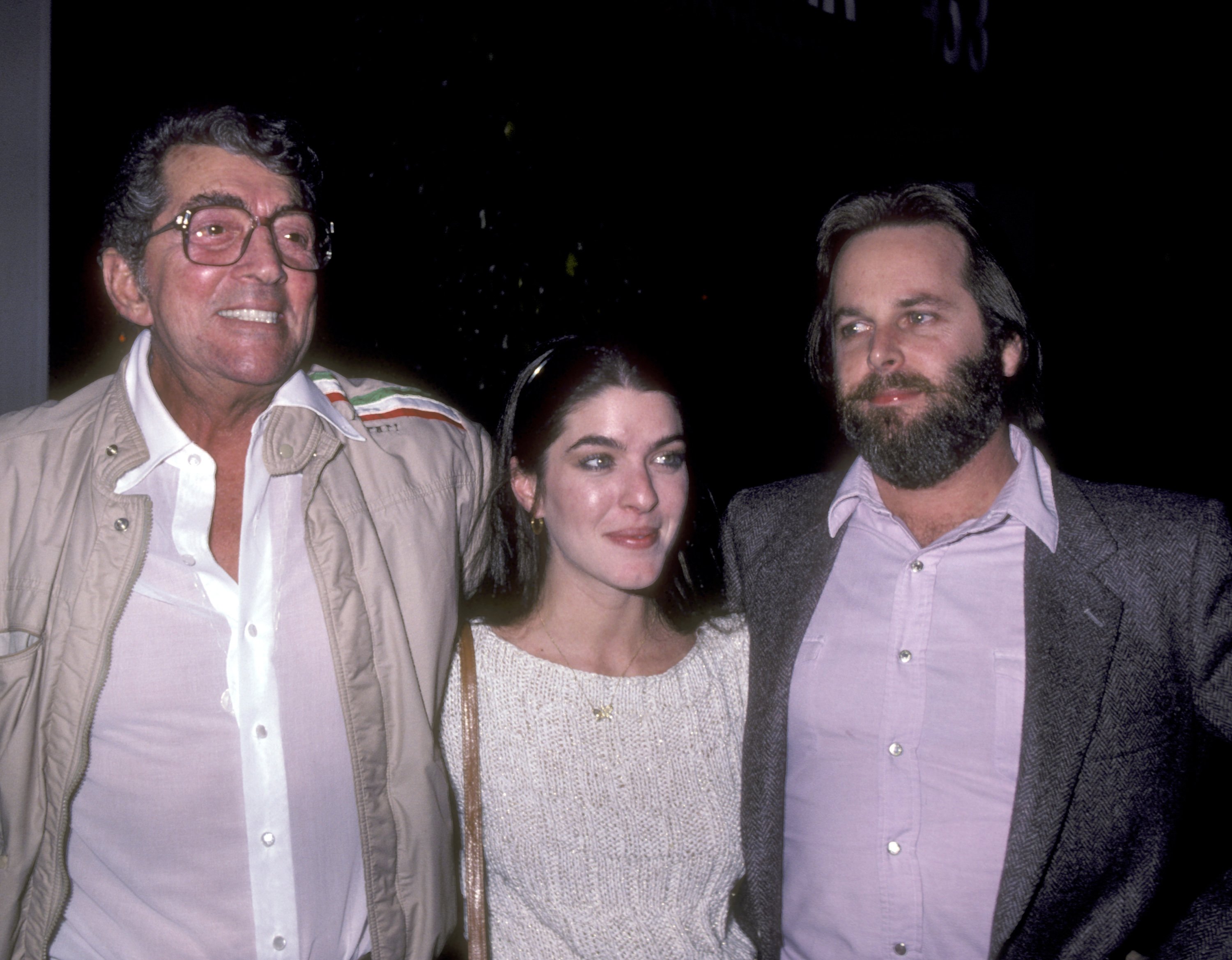 Dean Martin, Gina Martin, and Carl Wilson at La Famiglia Restaurant in Beverly Hills, California, on January 13, 1983. | Source: Getty Images