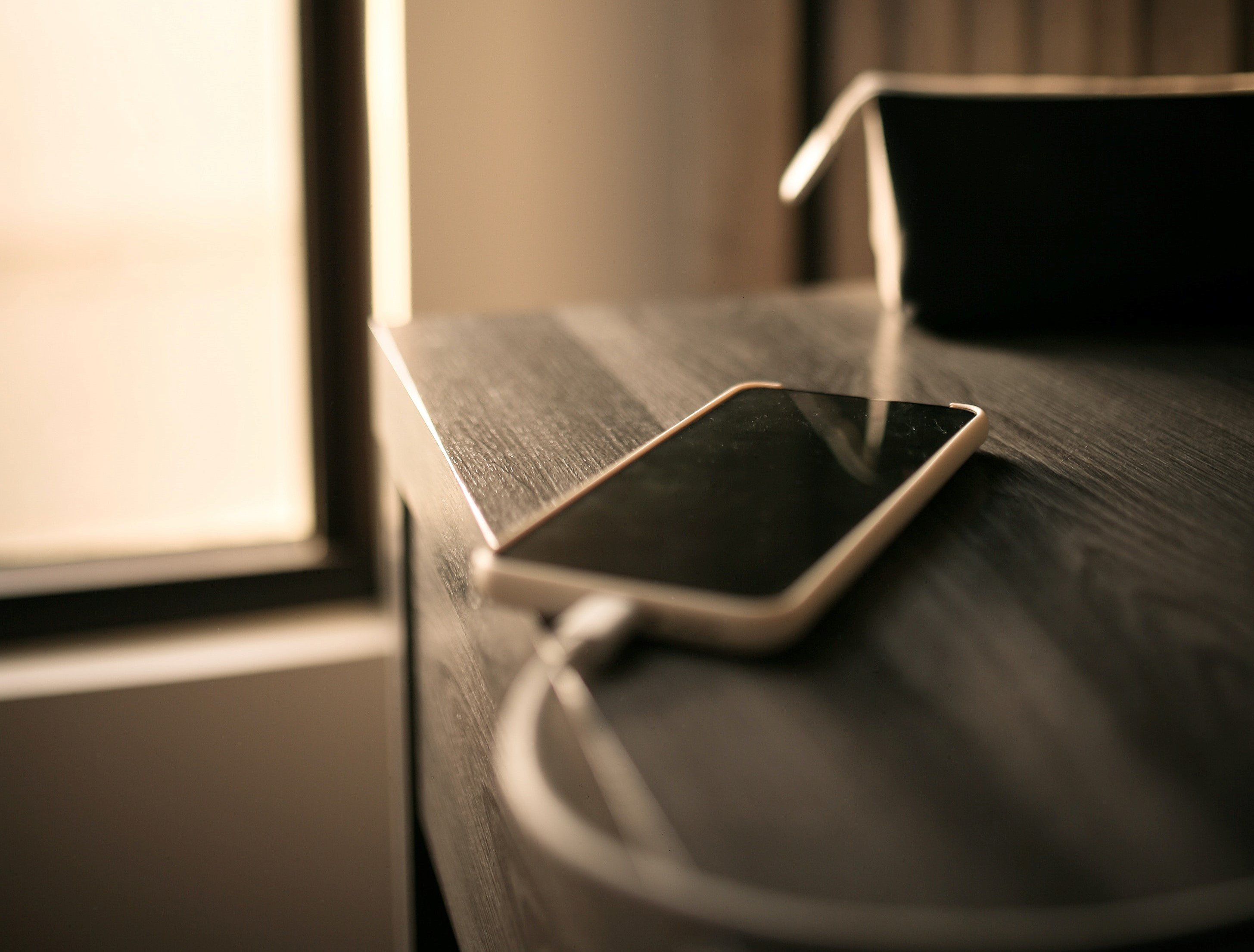 OP's husband left his phone for charging in the living room | Photo: Unsplash  