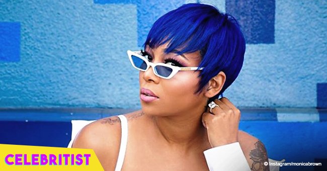 Monica Brown stops hearts with blue pixie cut & matching velvet jumpsuit in latest pic