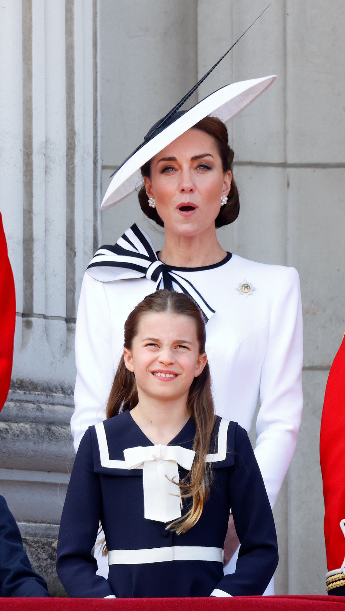 Princess Catherine reacts as she watches the Royal Air Force flypast with Princess Charlotte from Buckingham Palace in London on June 15, 2024. | Source: Getty Images