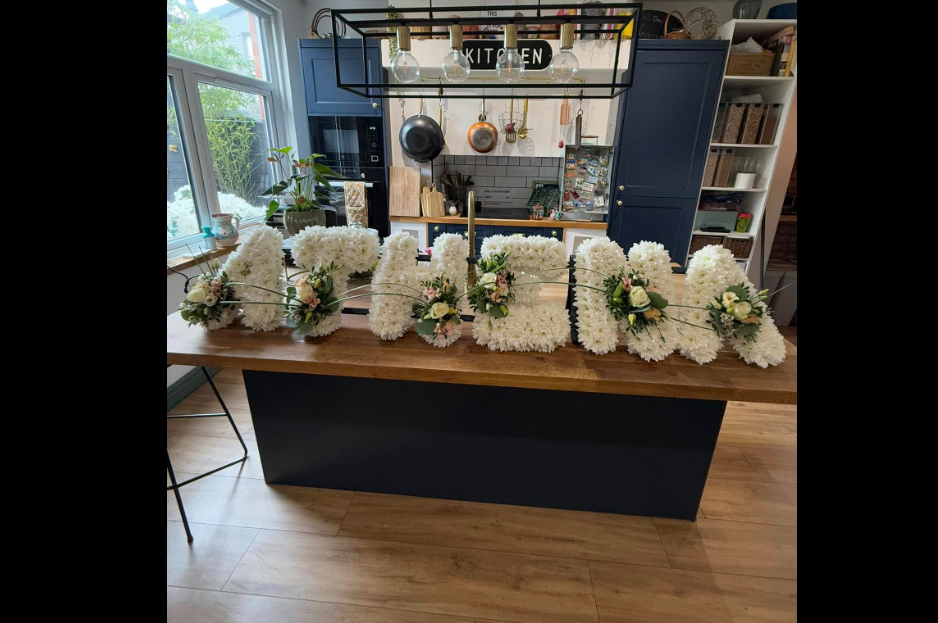 A flower arrangement spelling out the name Athena, dated March 3, 2025 | Source: Facebook/steven.darby.16