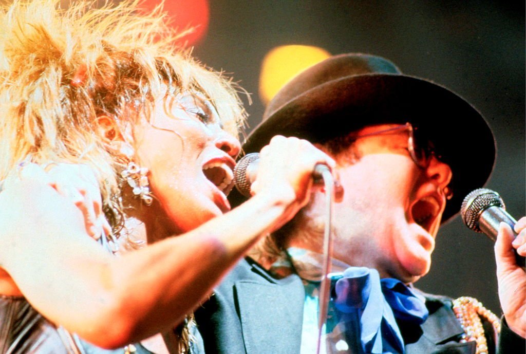 Tina Turner is joined onstage by Elton John, on one of four nights at Wembley Arena, London, during her Private Dancer Tour | Getty Images