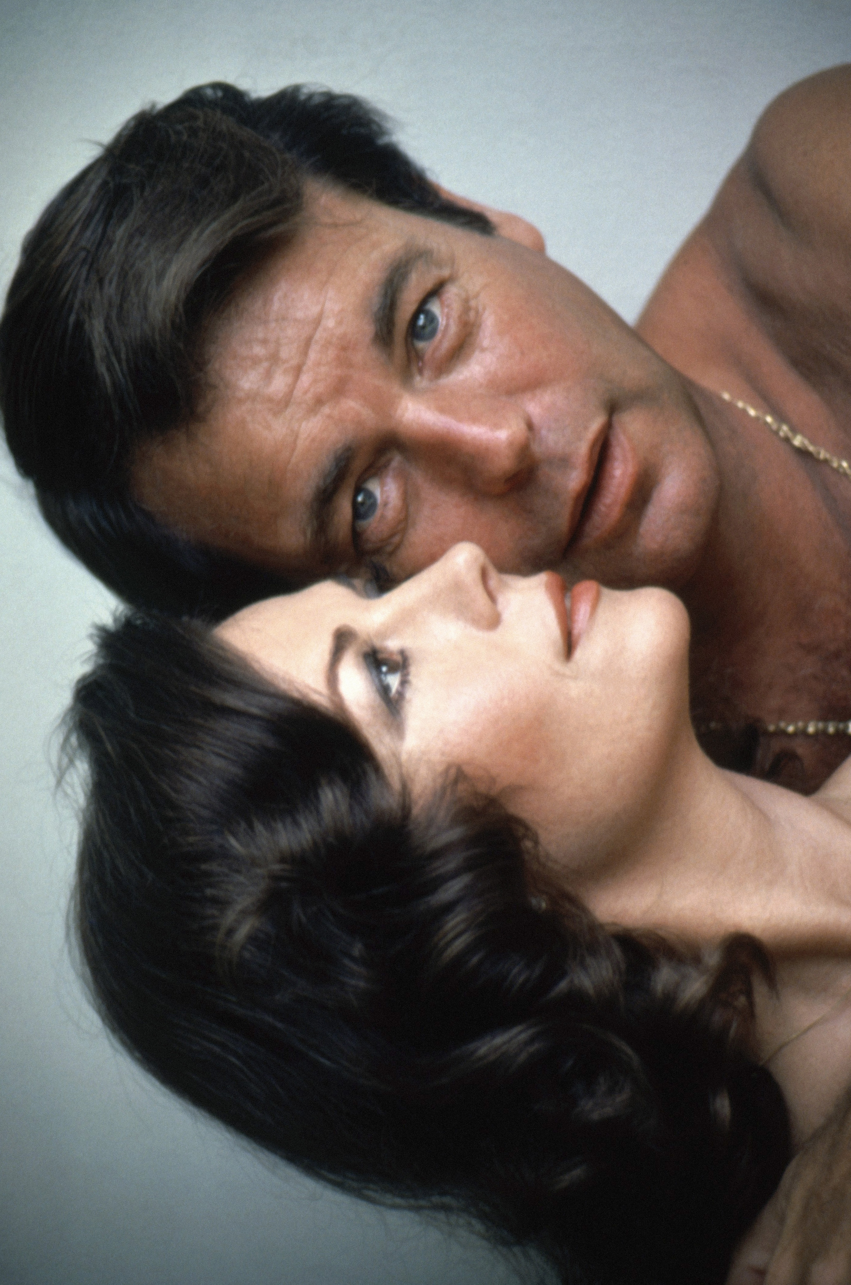 Natalie Wood and Robert Wagner pose for a sensual portrait bare-shouldered, circa 1972. | Source: Getty Images