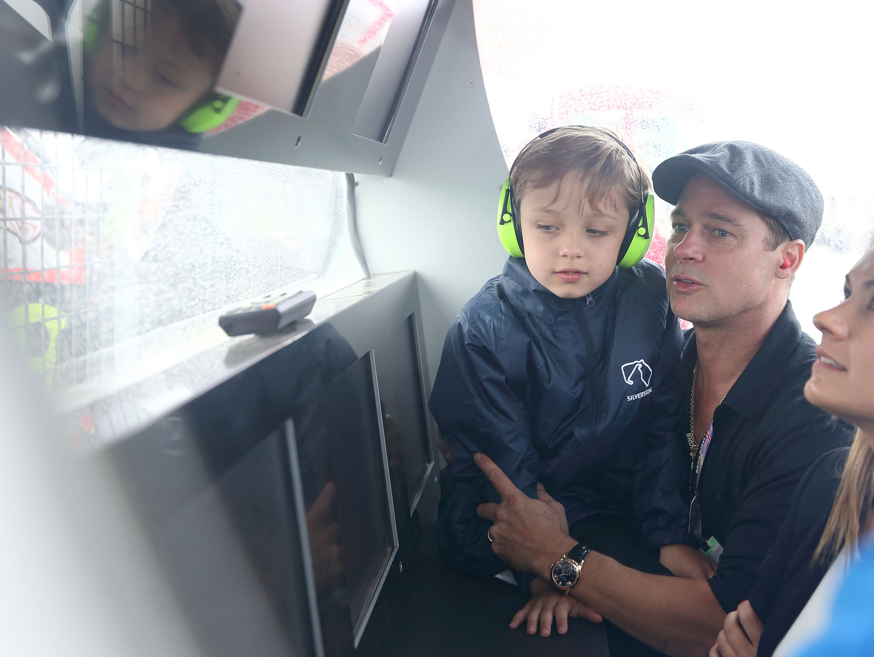 Brad Pitt and his son Knox Jolie-Pitt attend the MotoGP British Grand Prix race at Silverstone Circuit ahead of the release of the documentary "Hitting The Apex" on August 30, 2015, in Northampton, England.