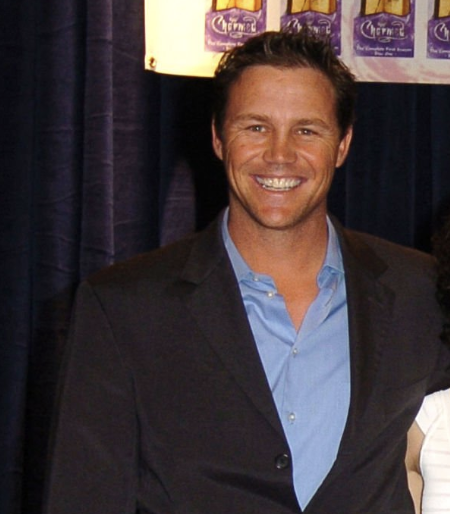 Brian Krause from "Charmed" celebrates the show’s 150th episode. He's seen posing with a wide smile, while marking the milestone during a promotional event in the mid-2000s.