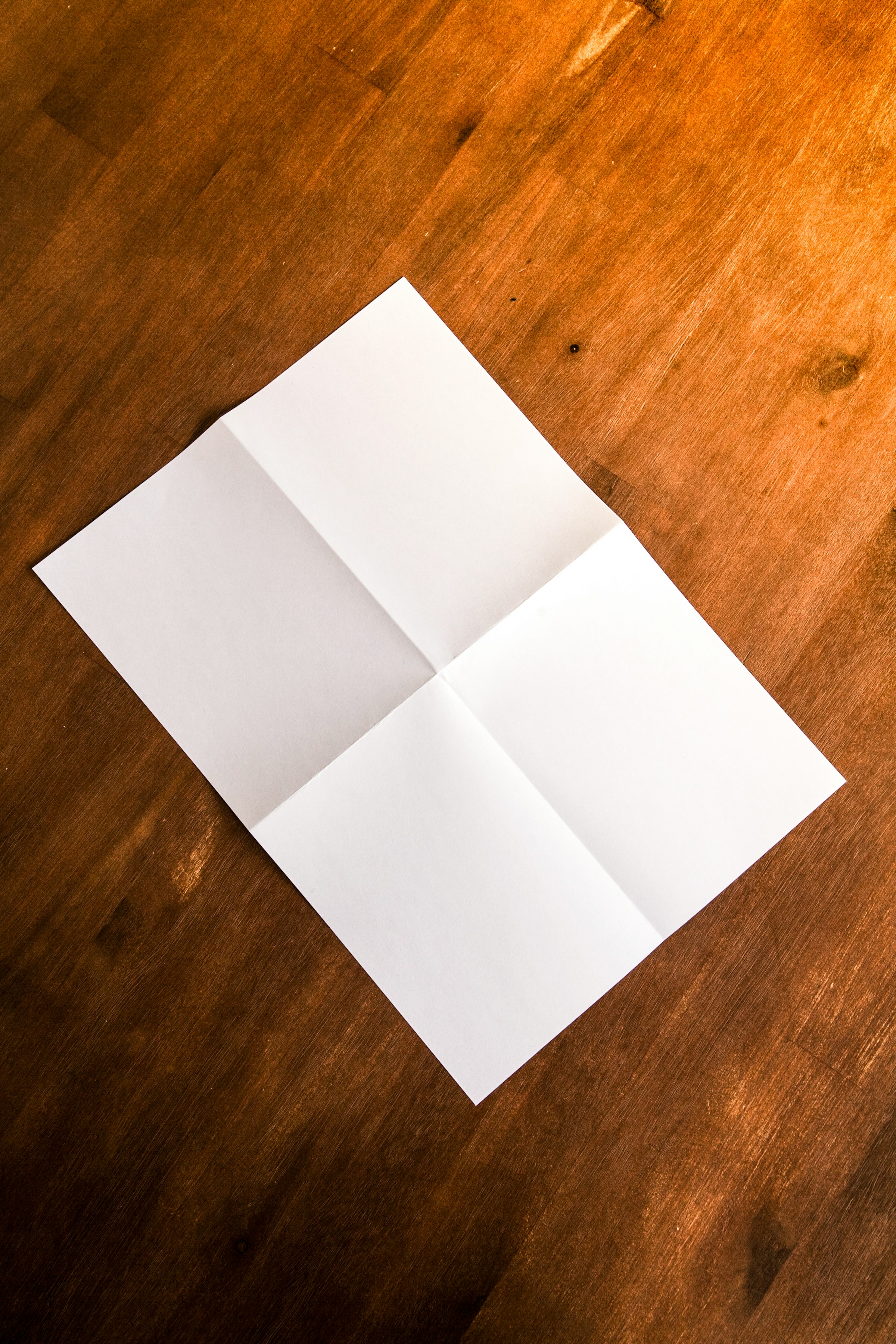 A folded piece of paper on the floor | Source: Unsplash