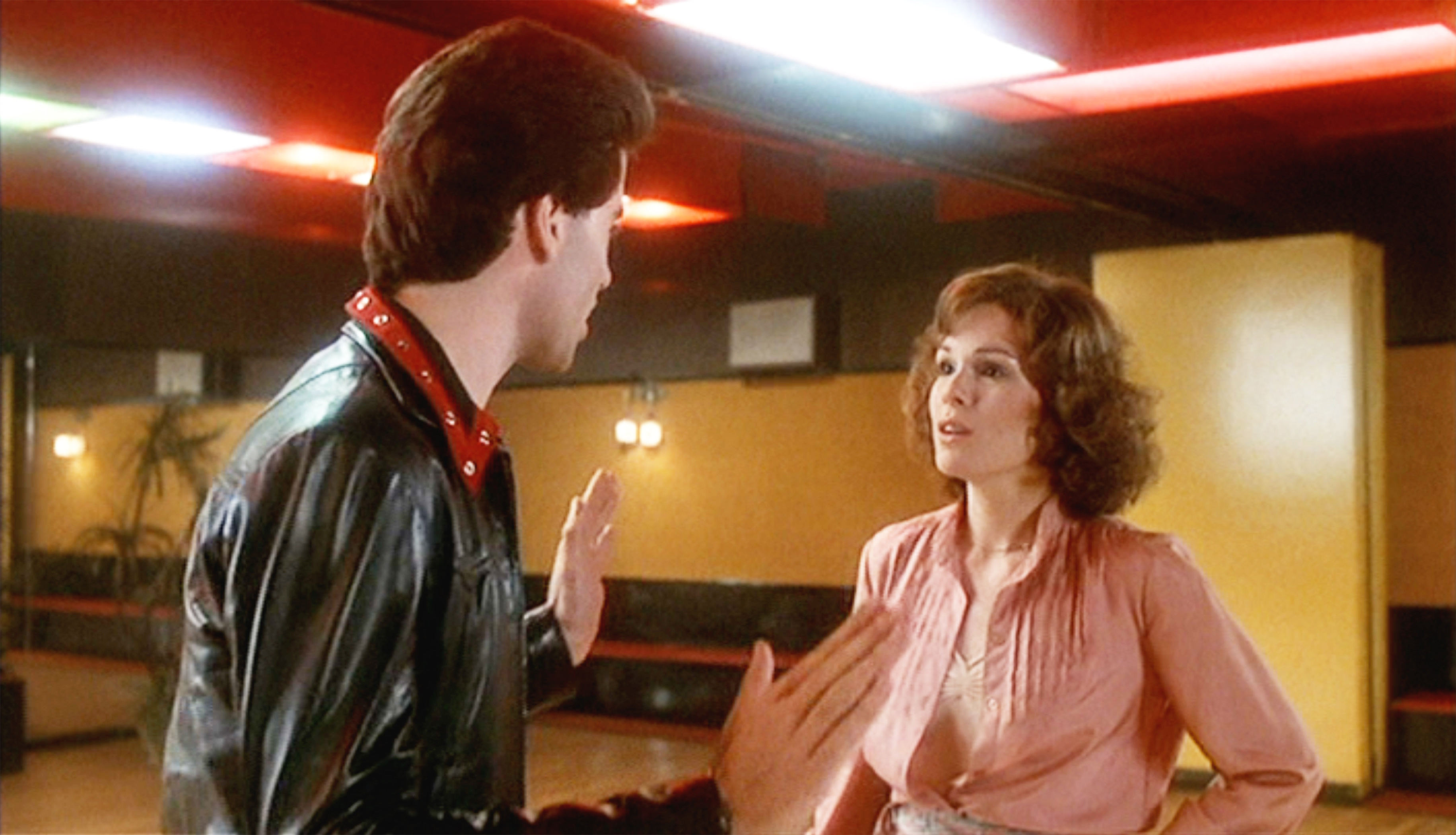 John Travolta and the actress on the set of "Saturday Night Fever" in 1977. | Source: Getty Images