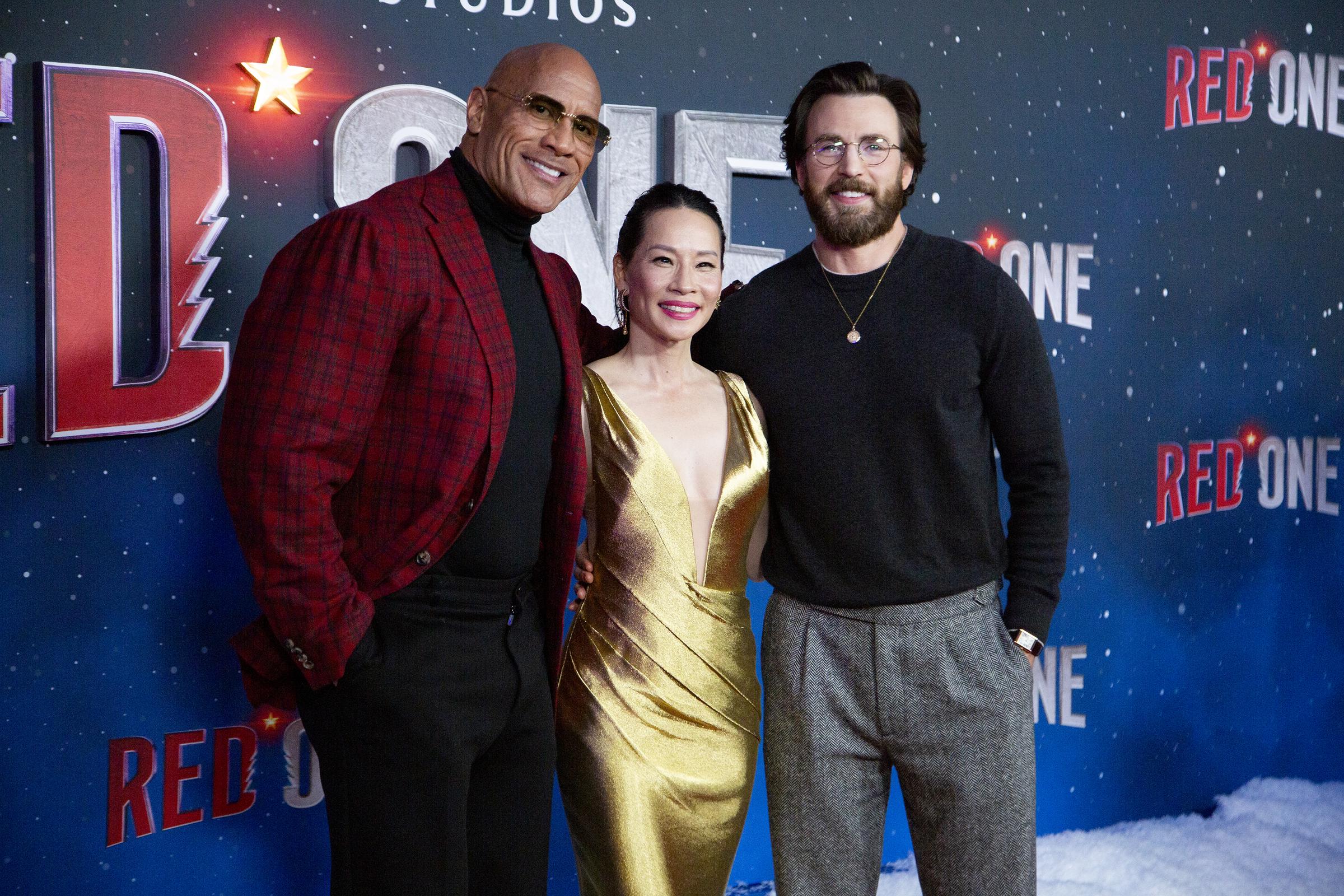 Dwayne Johnson, Lucy Liu, and Chris Evans on November 11, 2024, in New York City | Source: Getty Images