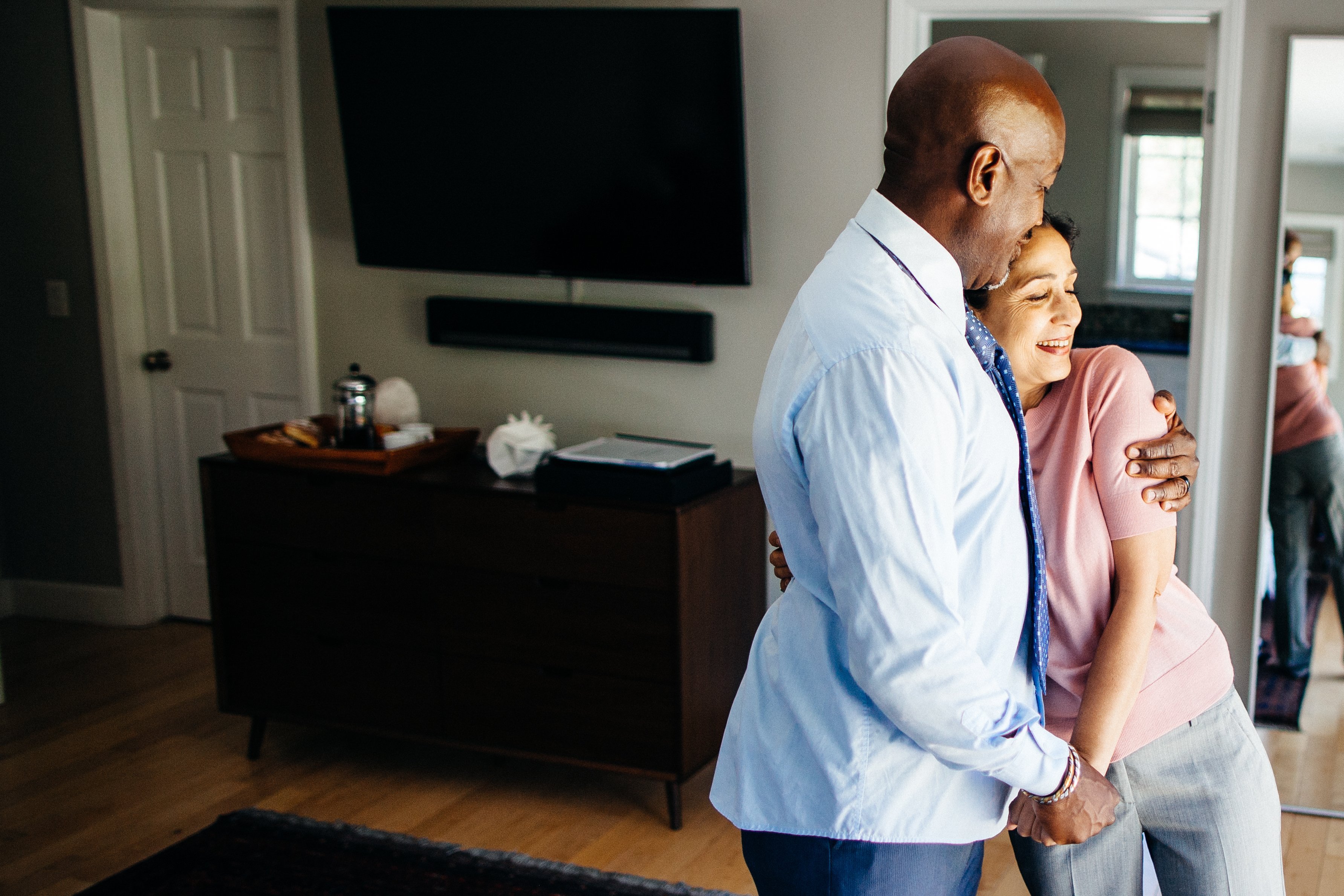 A mature mixed race couple in their suburban home, spending the day together |Photo: Getty Images