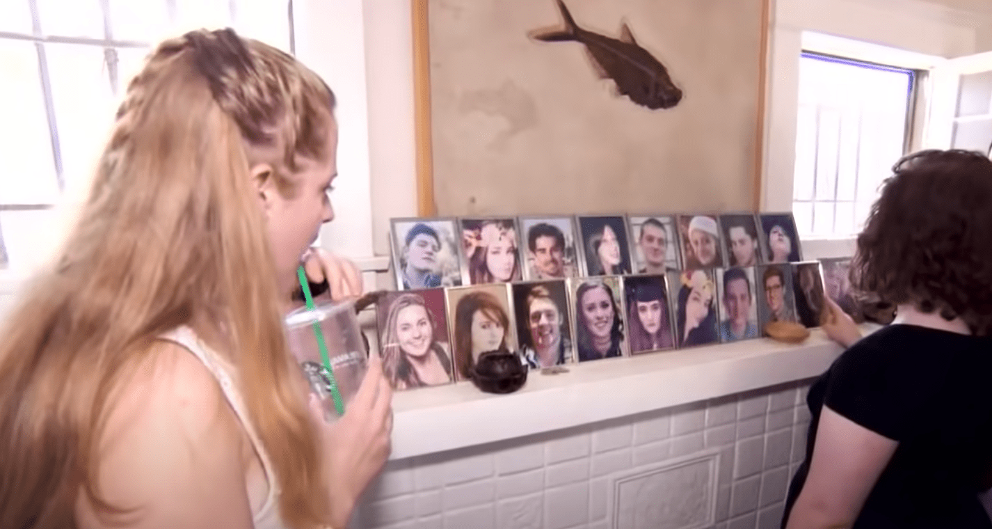 Kids see their photos on their dad's mantle. | Source: youtube.com/Inside Edition