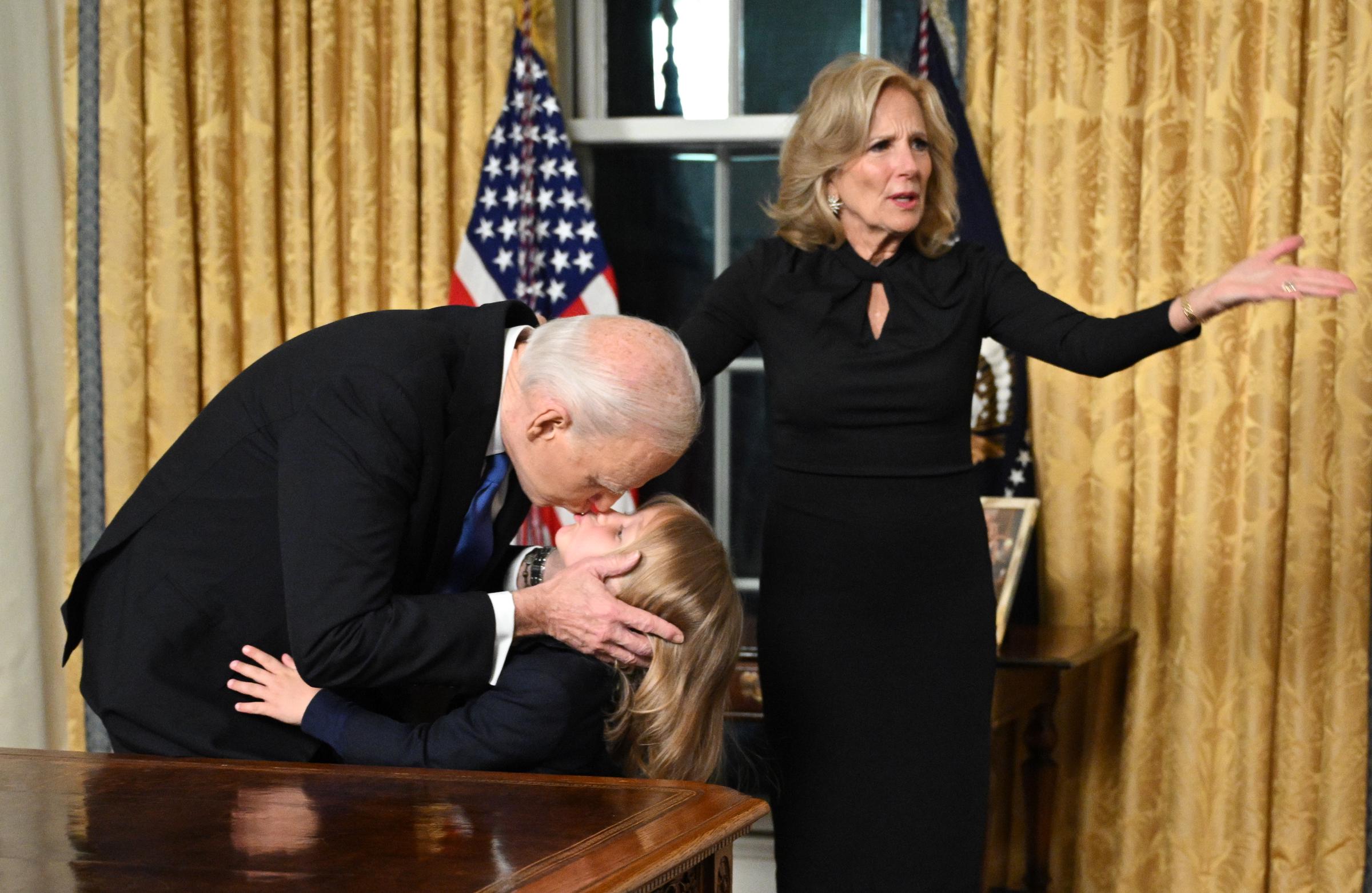 US President Joe Biden kisses Beau Biden Jr. as First Lady Jill Biden gestures at the White House on January 15, 2025, in Washington, D.C. | Source: Getty Images