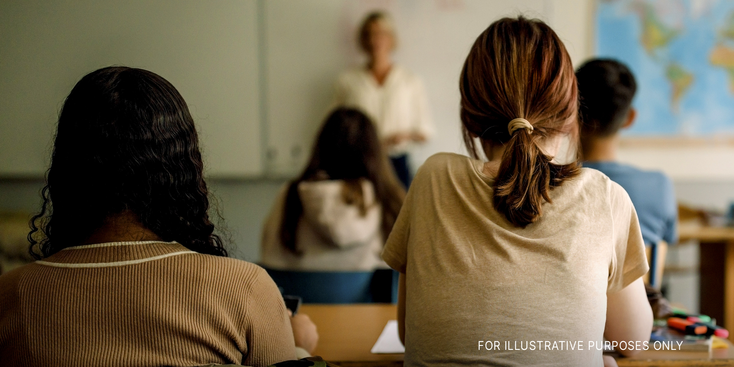 Teenage girls and boys learning in classroom | Source: Getty Images