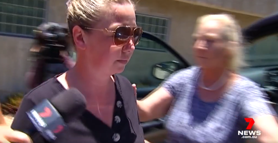 Laura Rose Peverill being ushered into a car after a court appearance for the death of her daughter Rylee Rose Black in a media coverage on July 14, 2023, in Townsville, Australia | Source: Facebook/7NEWS Townsville