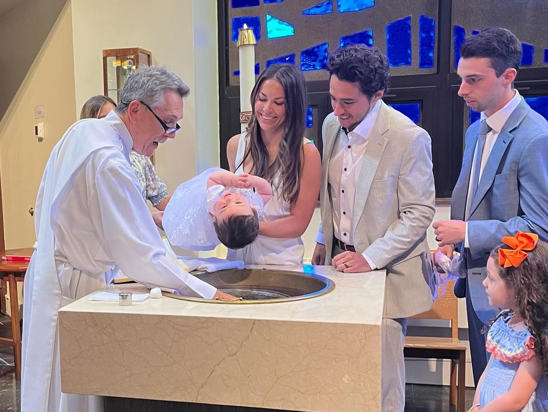 Noa, Meredith, Johnny, and Matty Gaudreau during Noas baptism, from an Instagram slideshow of pictures, dated September 1, 2024 | Source: Instagram/meredithgaudreau_