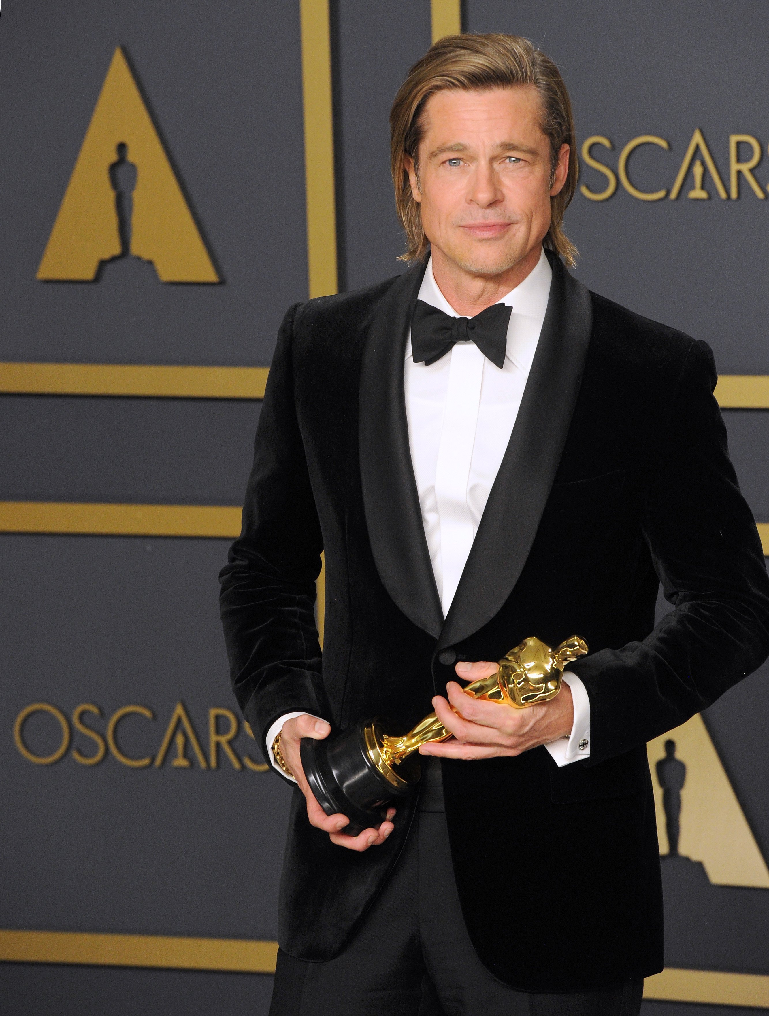 Brad Pitt poses with his Oscar for Best Actor in a Supporting Role for "Once Upon a Time...in Hollywood” on February 9, 2020, in Hollywood, California. | Source: Getty Images.