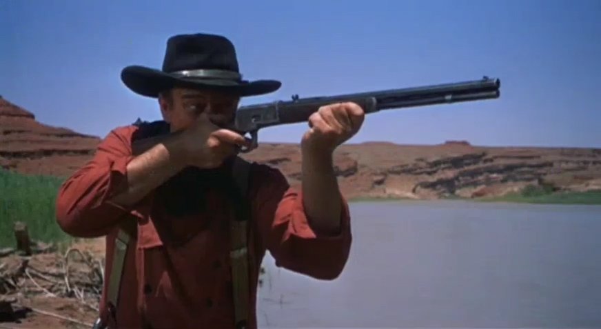 Joh Wayne in the searchers Ford Trailer. | Source: Wikimedia Commons Joh Wayne in the searchers Ford Trailer. | Source: Wikimedia Commons