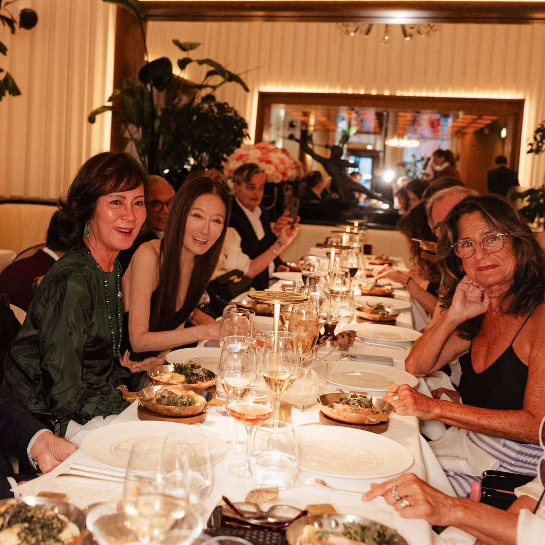 Vera Wang posing with friends while seated at a table at the Le Relais Plaza restaurant in Paris, France, from her post dated June 28, 2025 | Source: Instagram/verawang