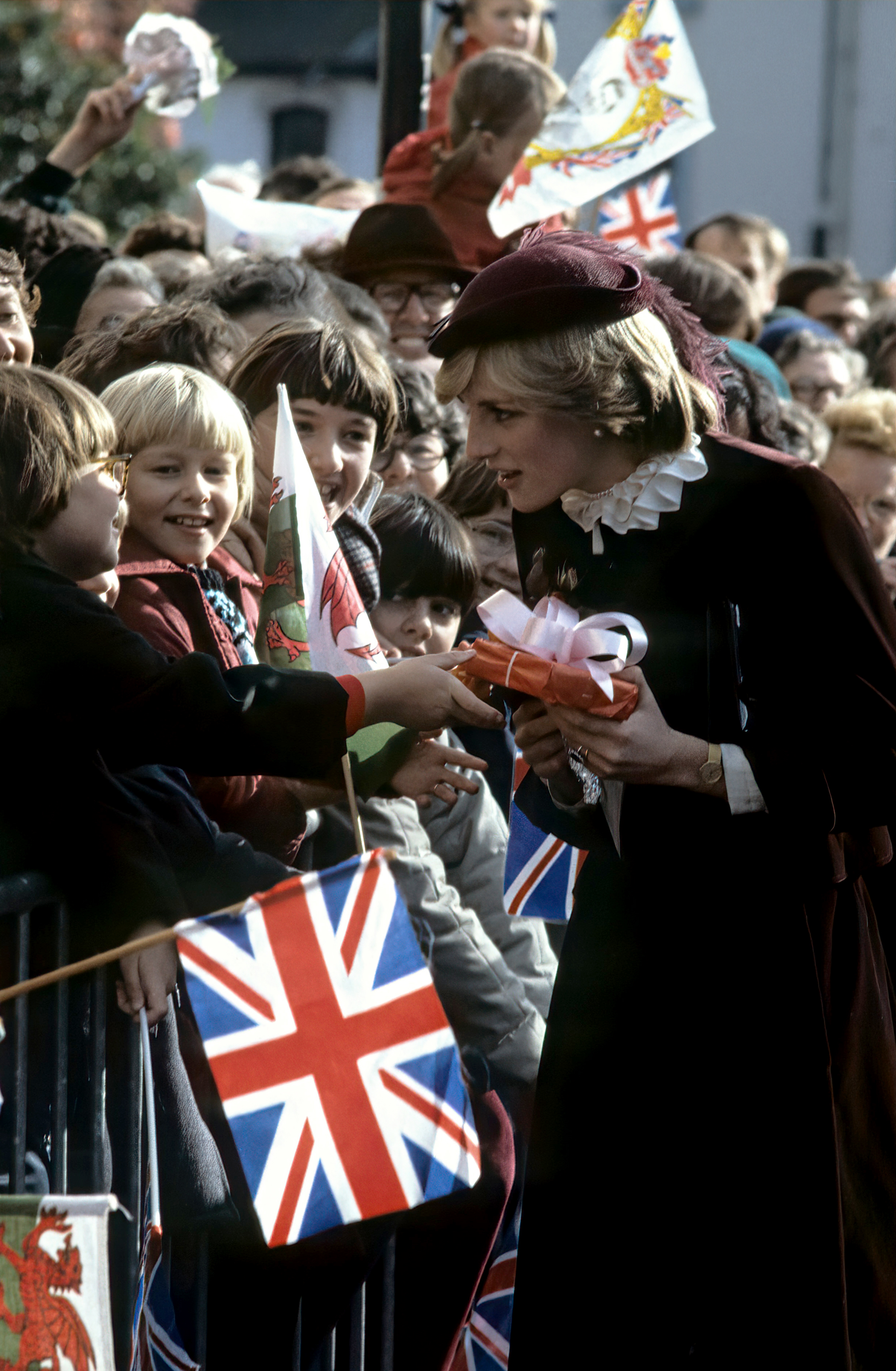 Princess Diana accepts a gift from a child during a walkabout in Brecon, Wales, on October 29, 1981 | Source: Getty Images