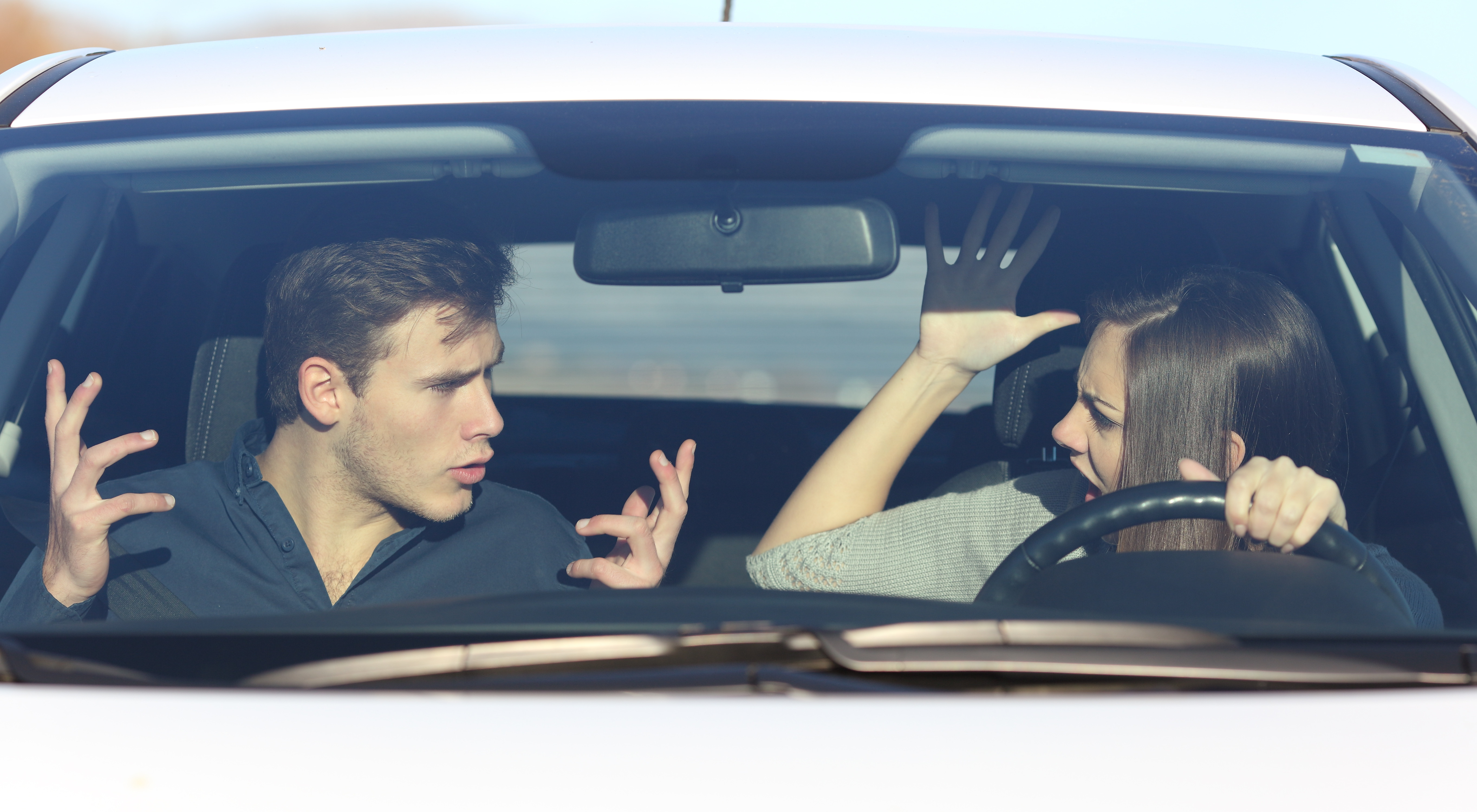 Couple arguing while she is driving a car | Source: Getty Images