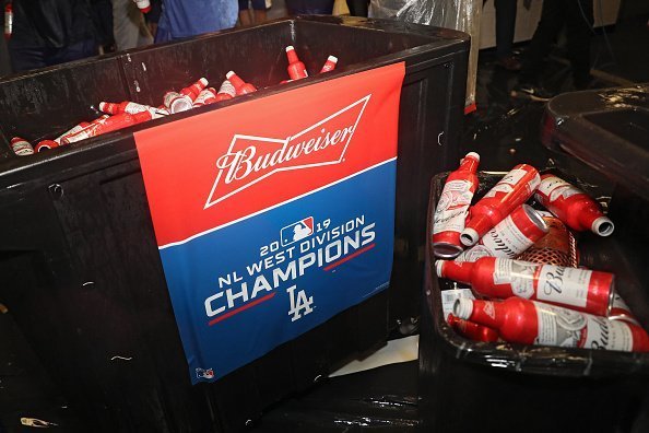 Budweiser beer is seen as the Los Angeles Dodgers celebrate in the clubhouse after defeating the Baltimore Orioles and clinching the National League West Division Title at Oriole Park at Camden Yards on September 10, 2019 in Baltimore, Maryland | Photo: Getty Images