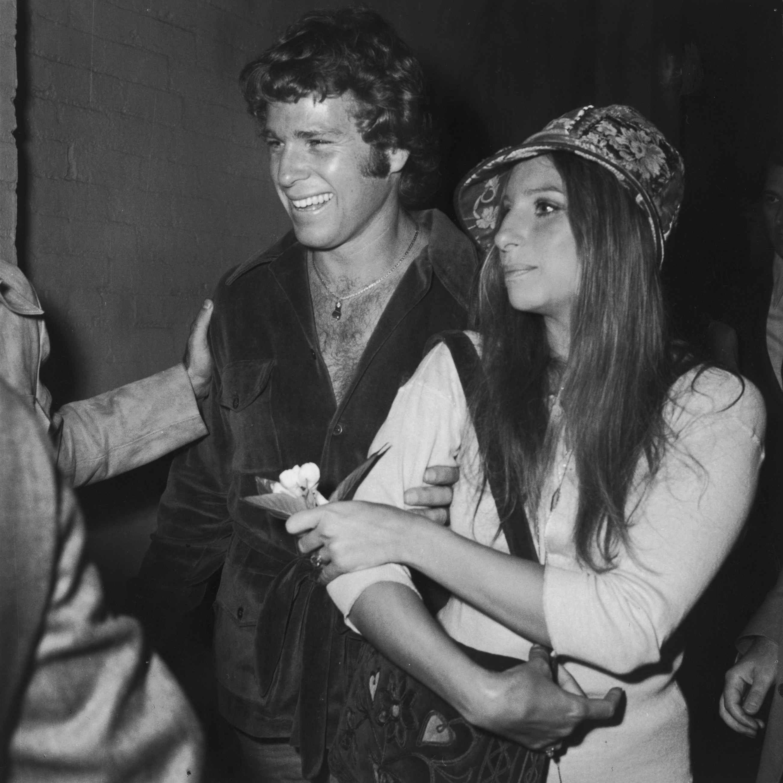 Barbra Streisand with actor Ryan O'Neal at a screening of the film "Wild Rovers," in which O'Neal starred, June 1971 | Source: Getty Images