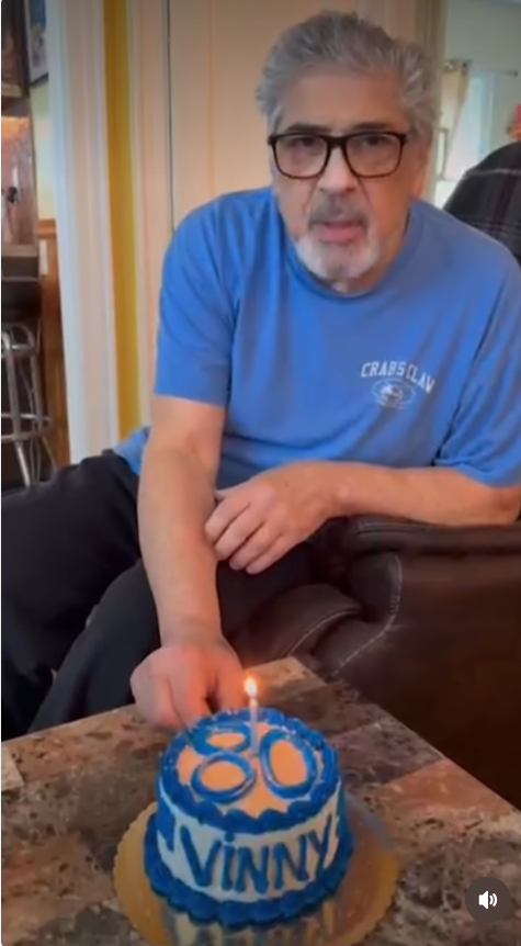 Vincent Pastore smiles beside a custom birthday cake decorated with his nickname, "Vinny," in a video shared by his longtime friend Stephen Villano. During the celebration, the actor jokingly refused to blow out the candle on the first take before laughing with friends as they sang "Happy Birthday" again. | Source: Instagram/tmztv