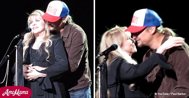 Kid Rock surprised Stevie Nicks with a hug and kiss on stage