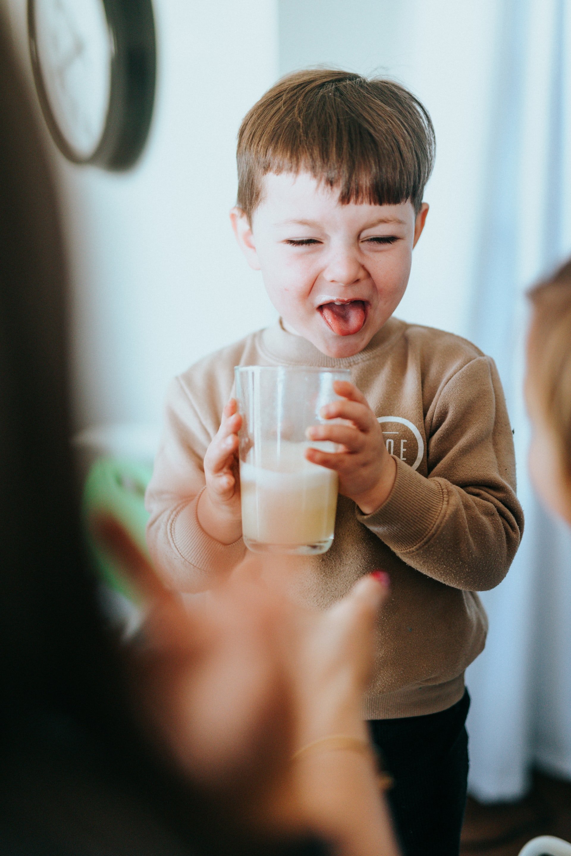 Boy drinking milk | Source: Unsplash