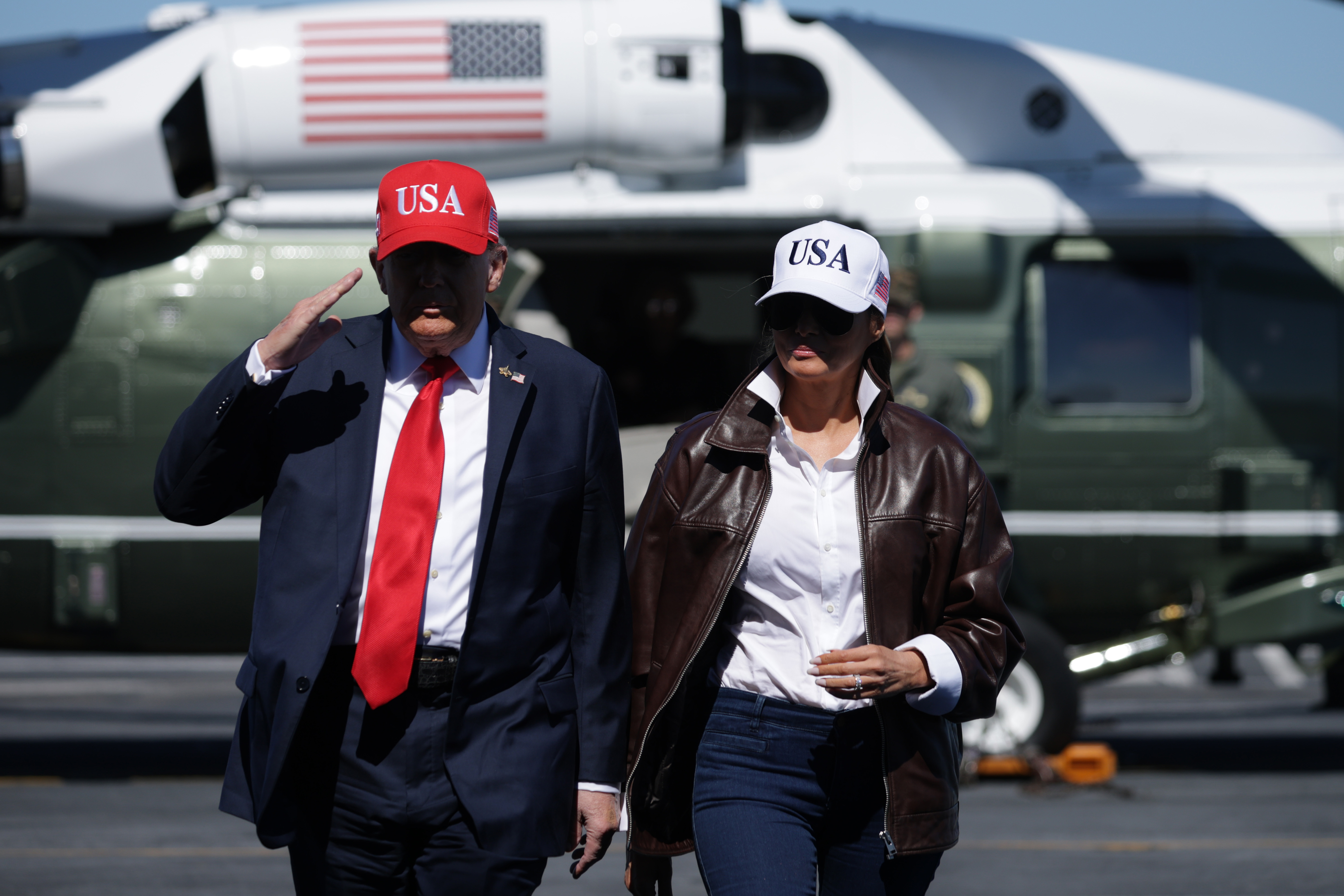 U.S. President Donald Trump and U.S. First Lady Melania Trump arriving on the deck of the USS George H.W. Bush aircraft carrier in Virginia on October 5, 2025. | Source: Getty Images
