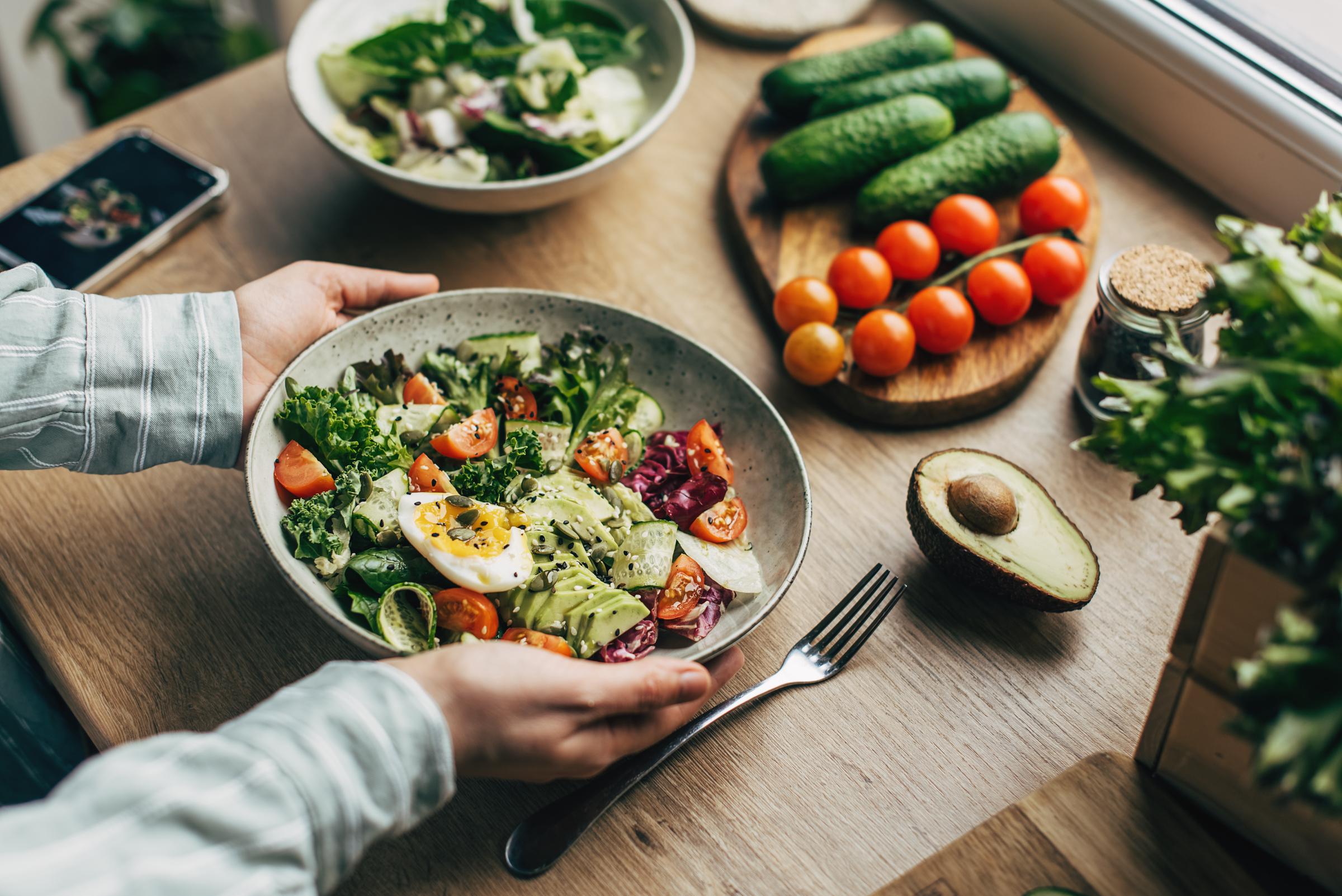 A woman preparing a salad | Source: Getty Images