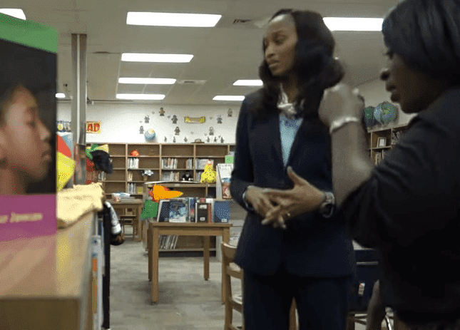 Dr. Belinda George talking to a member of the staff during work hours | Photo: 12 News Now