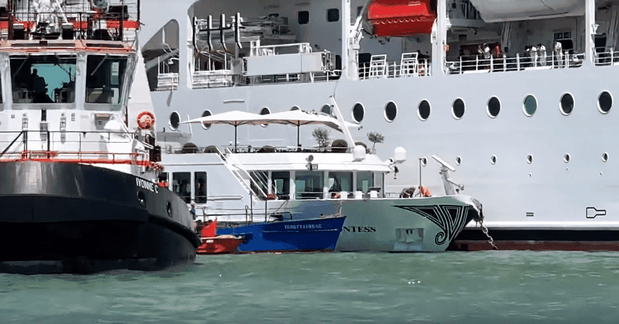 One of the towboats next to the River Countess riverboat and the MSC Opera cruise ship | Photo:  Cruises and Travels Blog