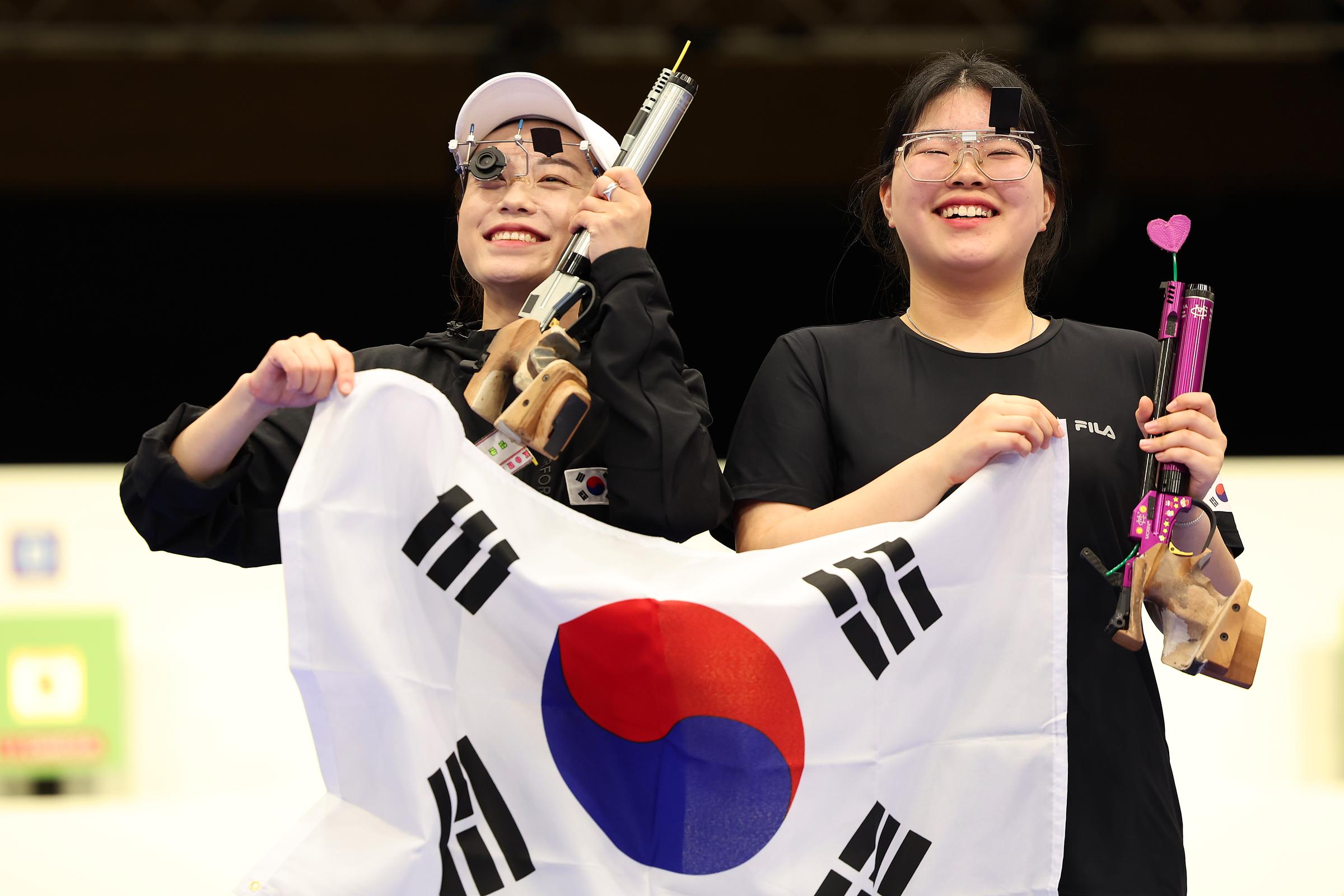 Kim Yeji and Oh Ye Jin celebrate after the Women's 10m Air Pistol Final at the Paris Olympic Games on July 28, 2024, in Chateauroux, France | Source: Getty Images