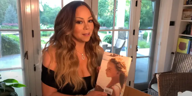 Mariah Carey with her memoir, "The Meaning of Mariah Carey." | Source: YouTube/Mariah Carey