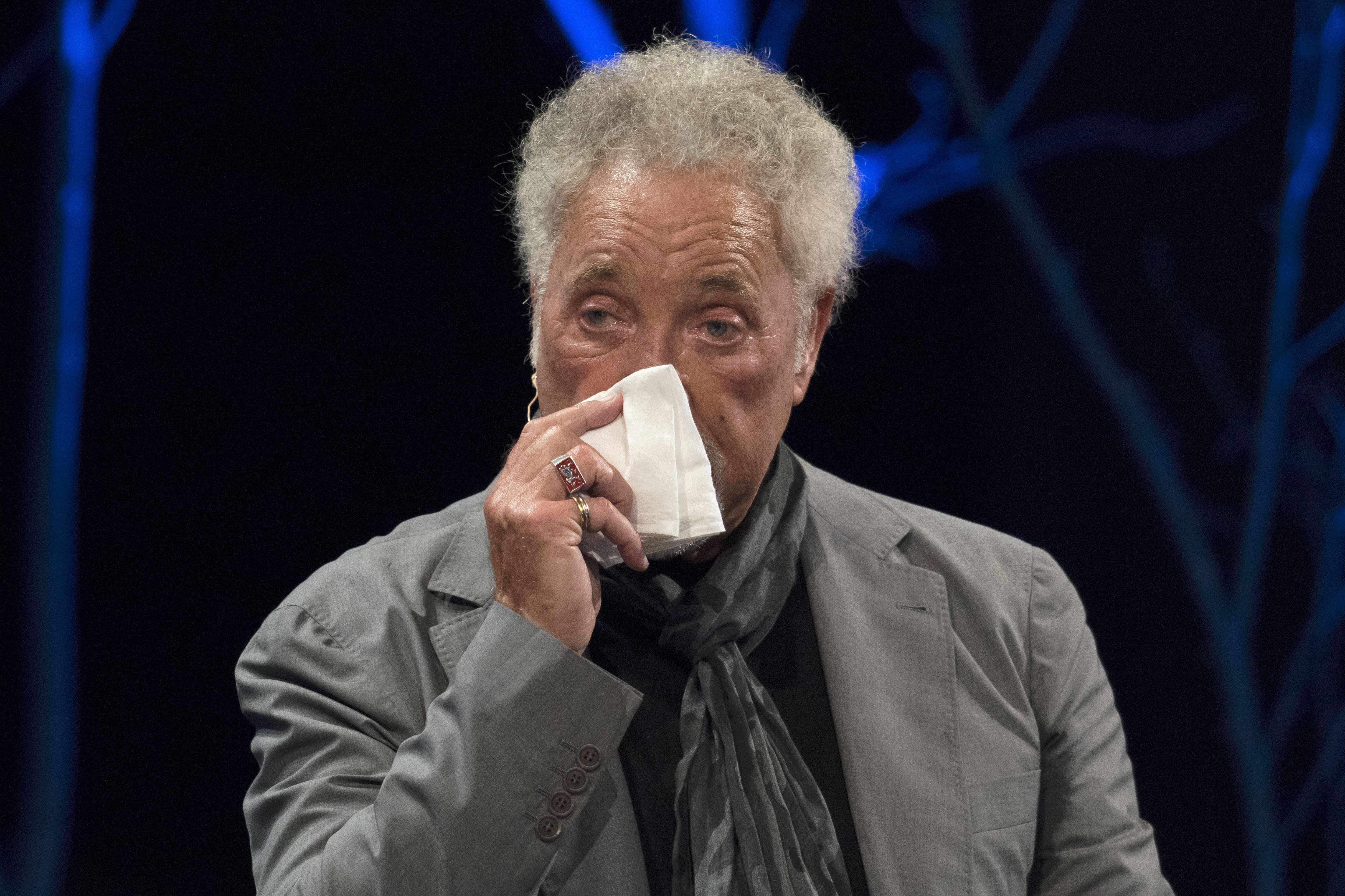 Sir Tom Jones appears to fight back tears during the 2016 Hay Festival on June 5, 2016 in Hay-on-Wye, Wales | Source: Getty Images