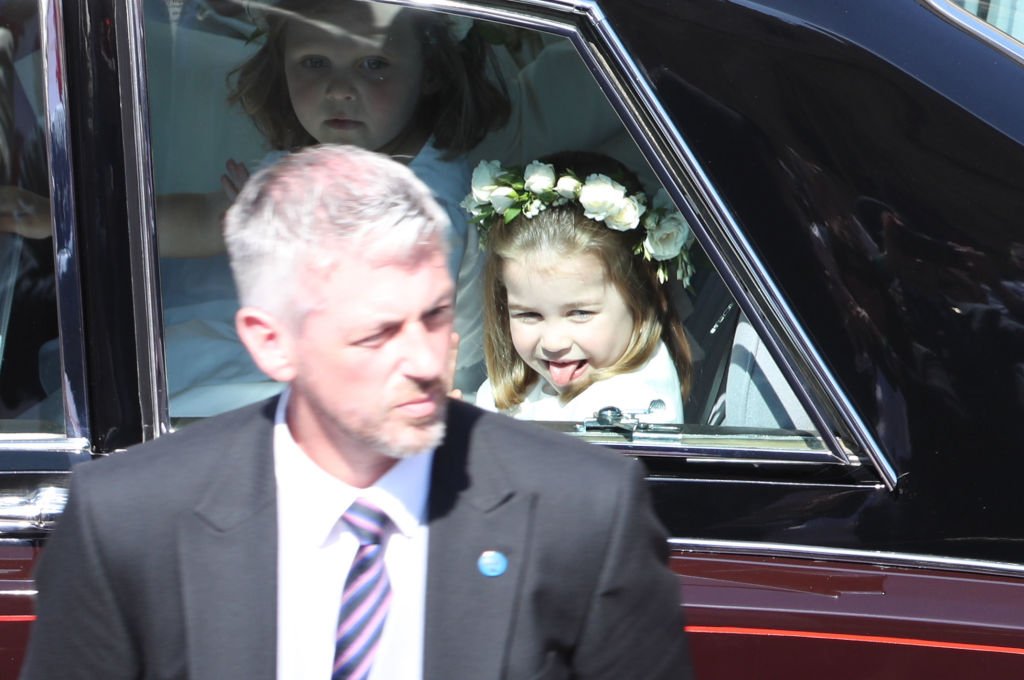 Princess Charlotte rides in a car to the wedding of Prince Harry and Meghan Markle at St George's Chapel in Windsor Castle on May 19, 2018 in Windsor, England | Source: Getty Images