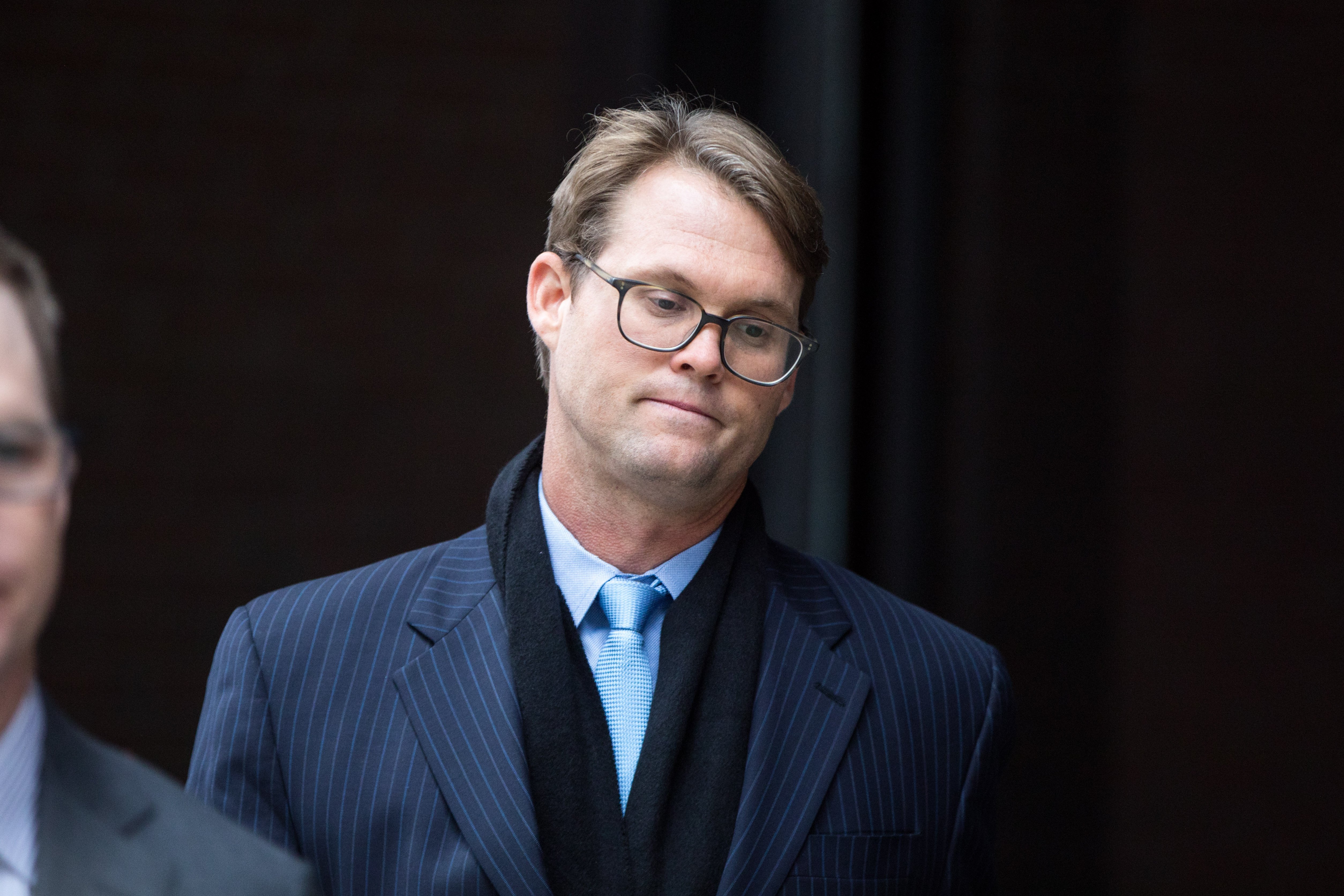 Mark Riddell looking broken after pleading guilty at Boston Federal Court | Photo: Getty Images
