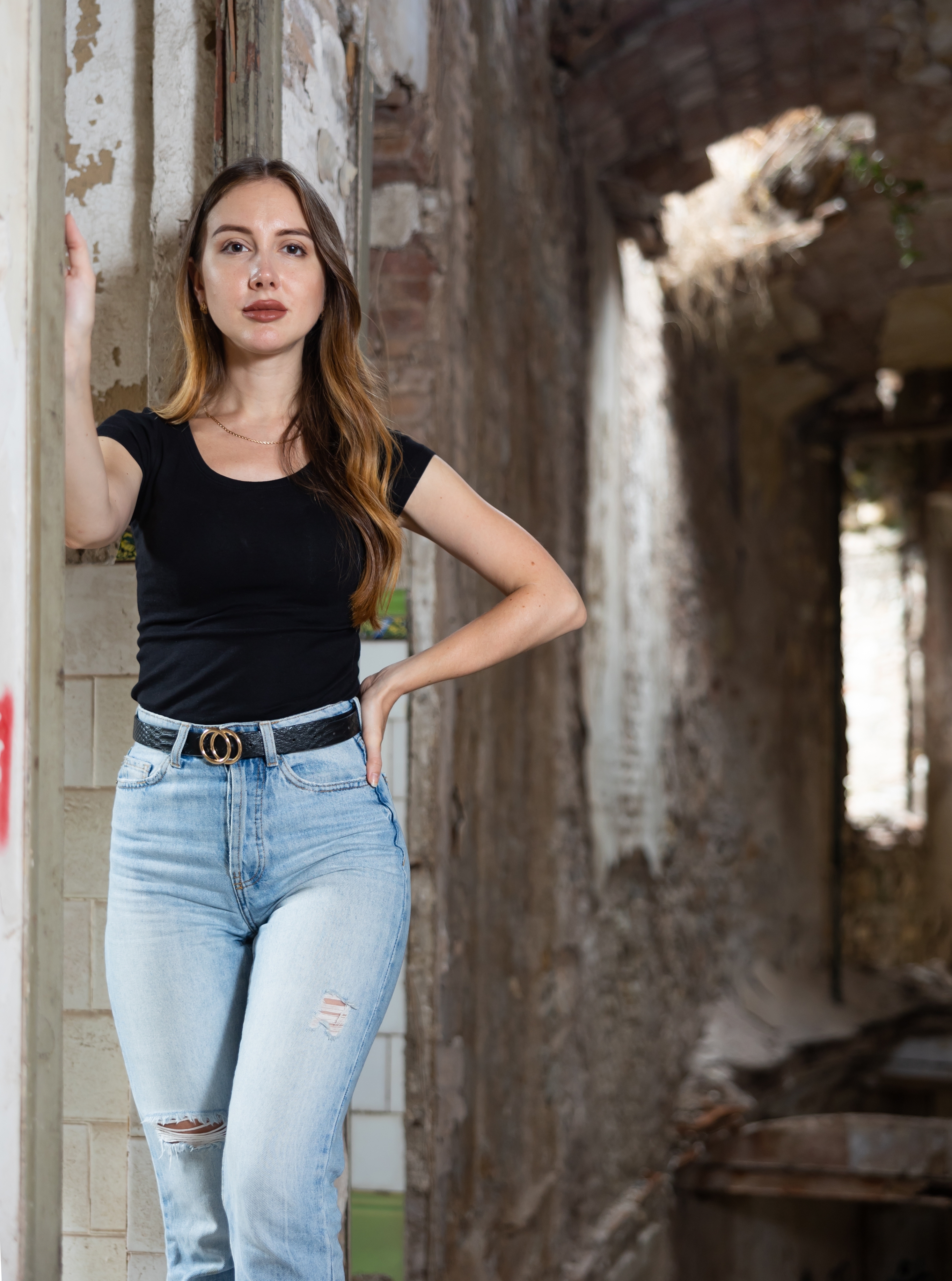 Photo of sensual young european woman inside of deserted building | Source: Shutterstock.com