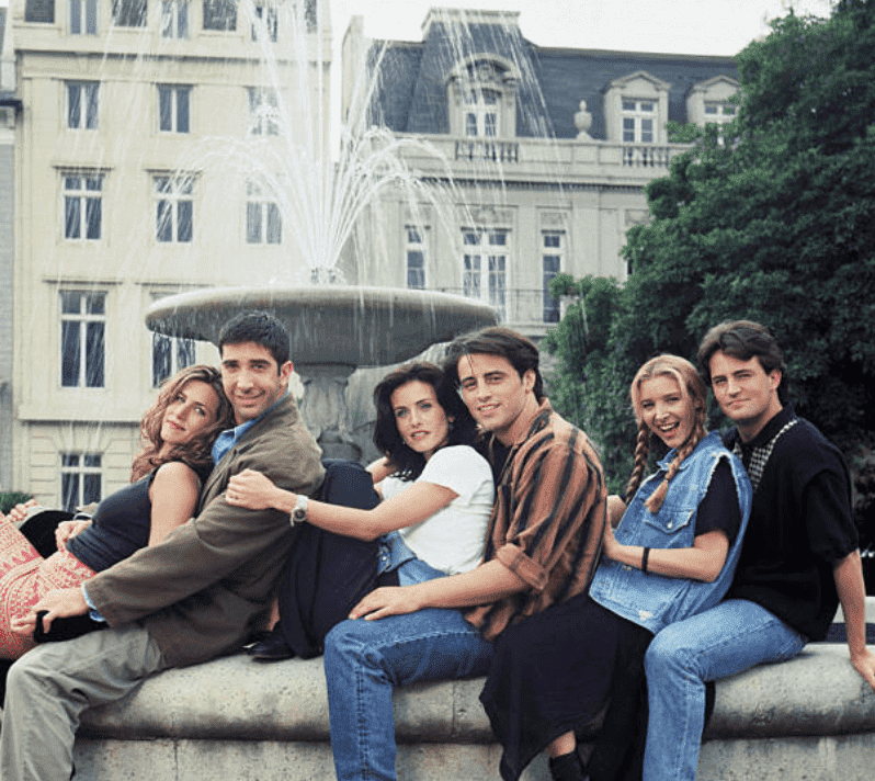 "Friends" co-stars; Jennifer Aniston, Courteney Cox, Matt Le Blanc, Matthew Perry, David Schwimmer and Lisa Kudrow pose together in front of a flowing fountain, on June 15, 1994| Source: Reisig & Taylor/NBCU Photo Bank/NBCUniversal via Getty Images 