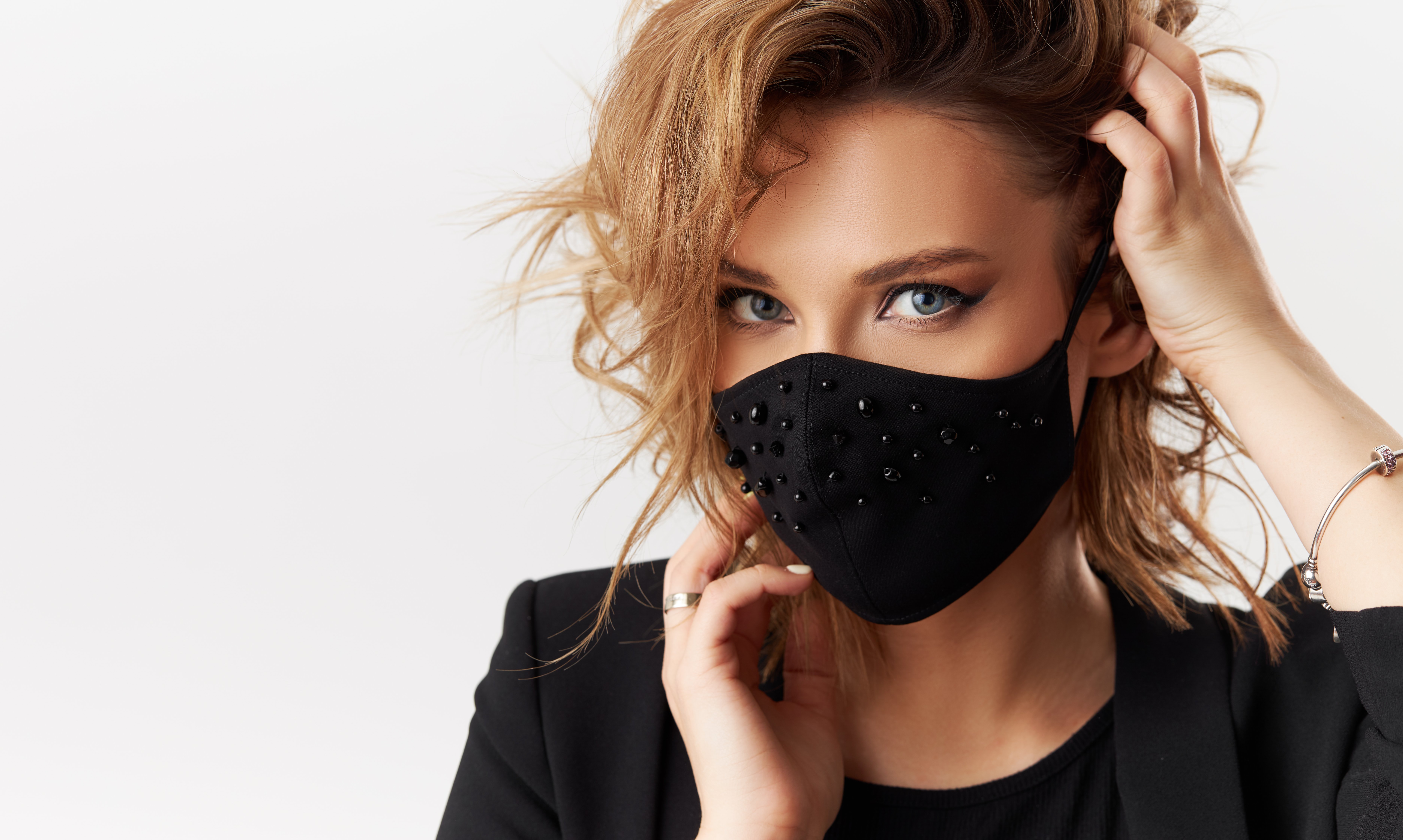 Beautiful woman with a face mask. | Source: Getty Images