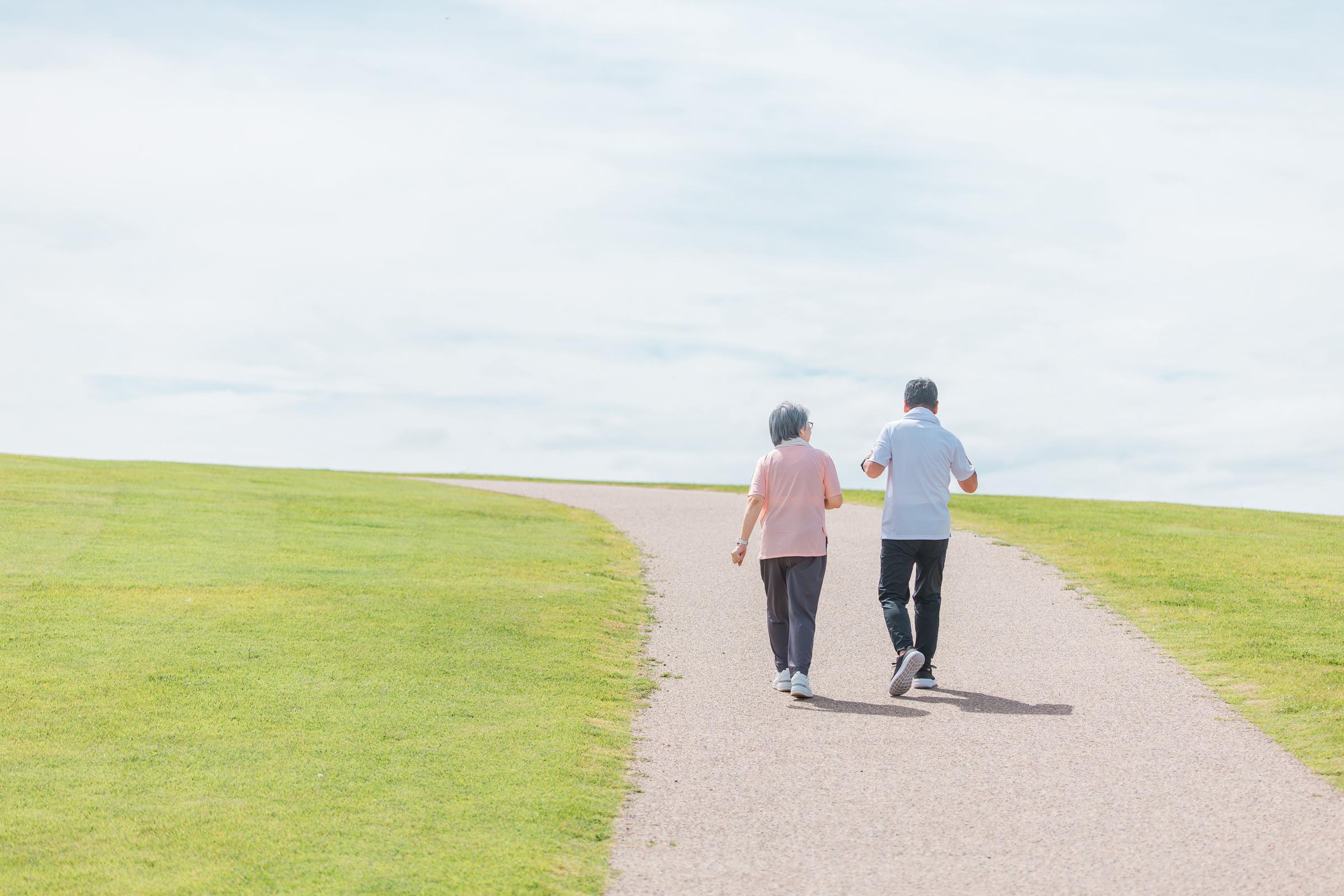 An elderly couple walking | Source: Shutterstock