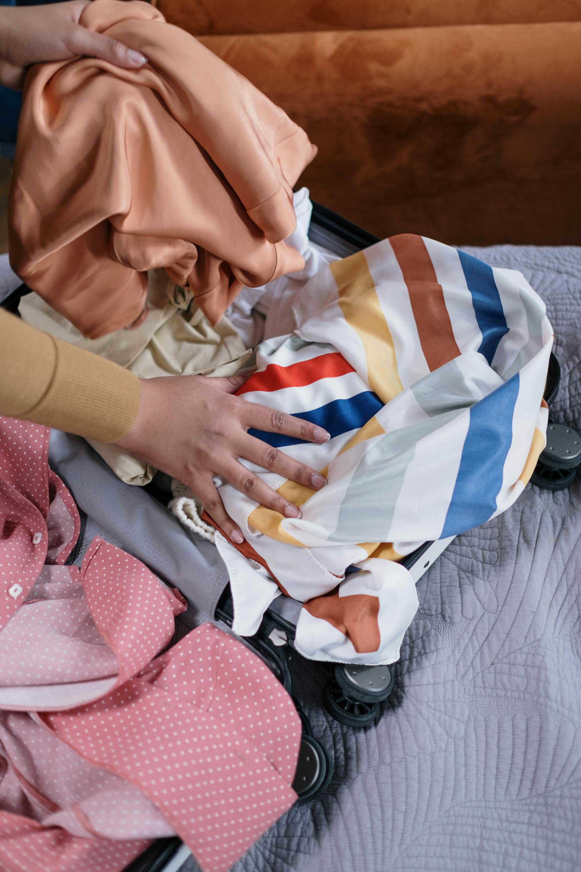 A woman packing a suitcase | Source: Pexels