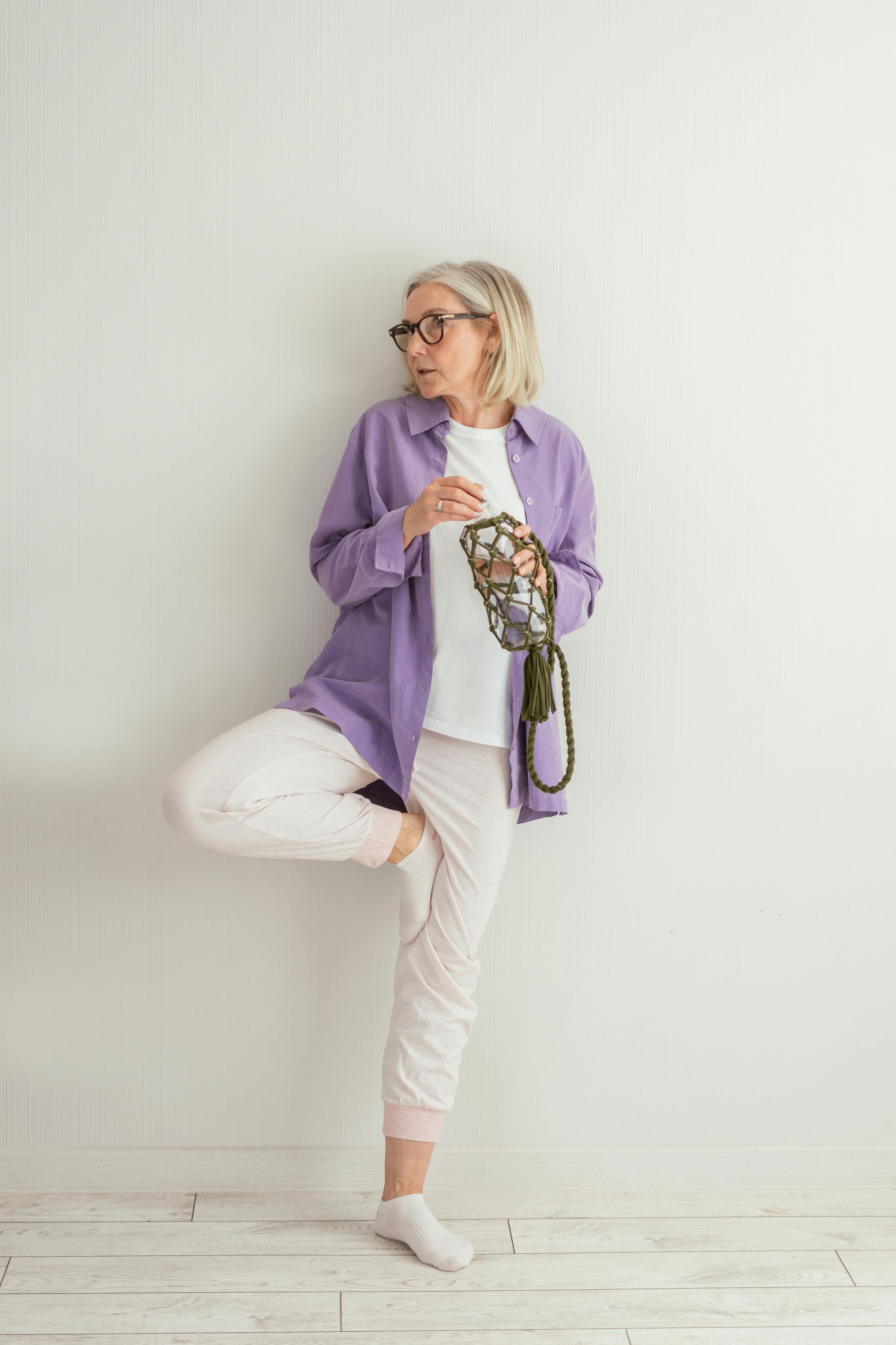 A woman about to drink water | Source: Pexels