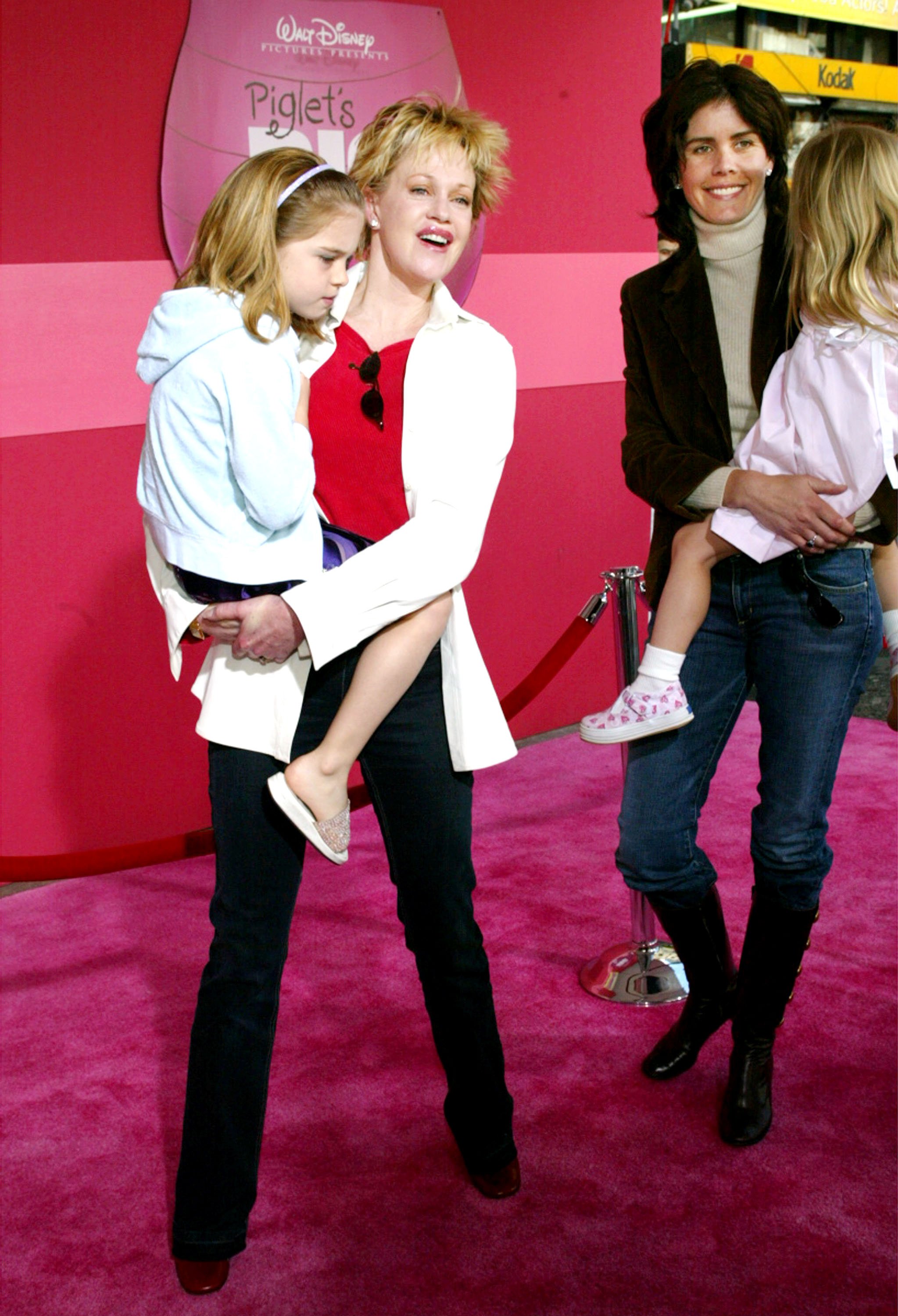 Melanie Griffith and Kelley Phleger with their children at the film premiere of "Piglet's Big Movie" on March 16, 2003, in Hollywood, California | Source: Getty Images