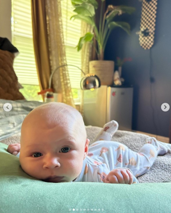 Ireland Baldwin's daughter lying on a bed in a Mother's Day post dated May 12, 2024 | Source: Instagram/irelandirelandireland