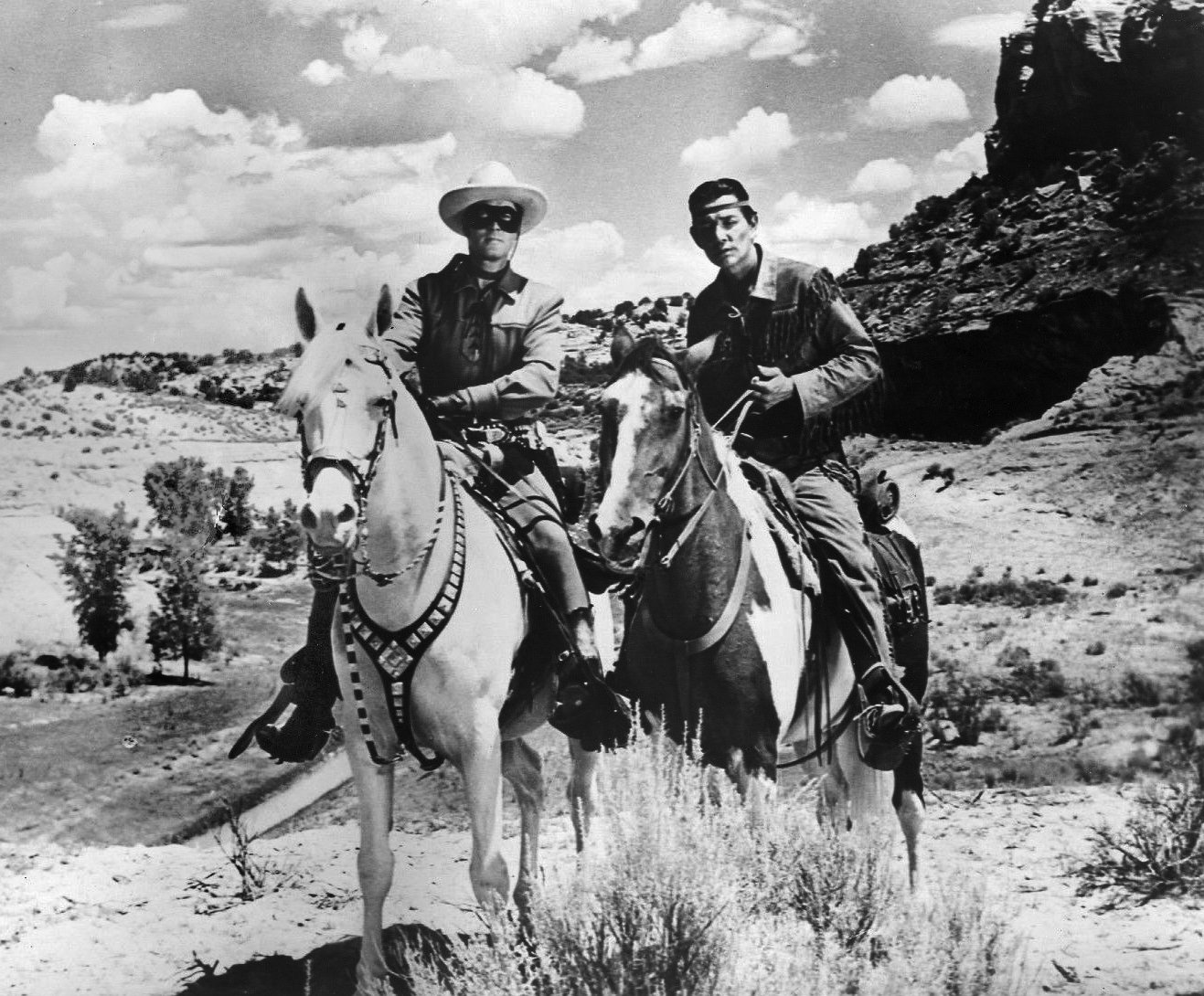 Clayton Moore as the "Lone Ranger" and Jay Silverheels as Tonto in 1956. | Source: Wikimedia Commons.