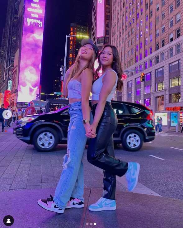 Suni Lee posing with someone in Time's Square, New York City, in an image uploaded on August 5, 2021 | Source: Instagram/sunisalee