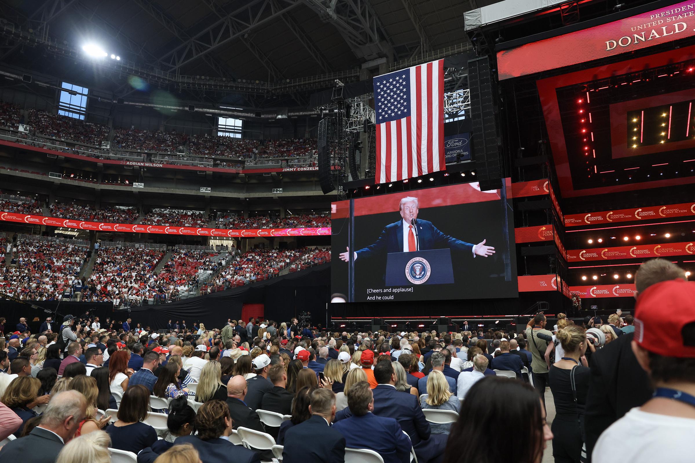 Donald Trump addressing the crowd gathered for Charlie Kirk's memorial service. | Source: Getty Images