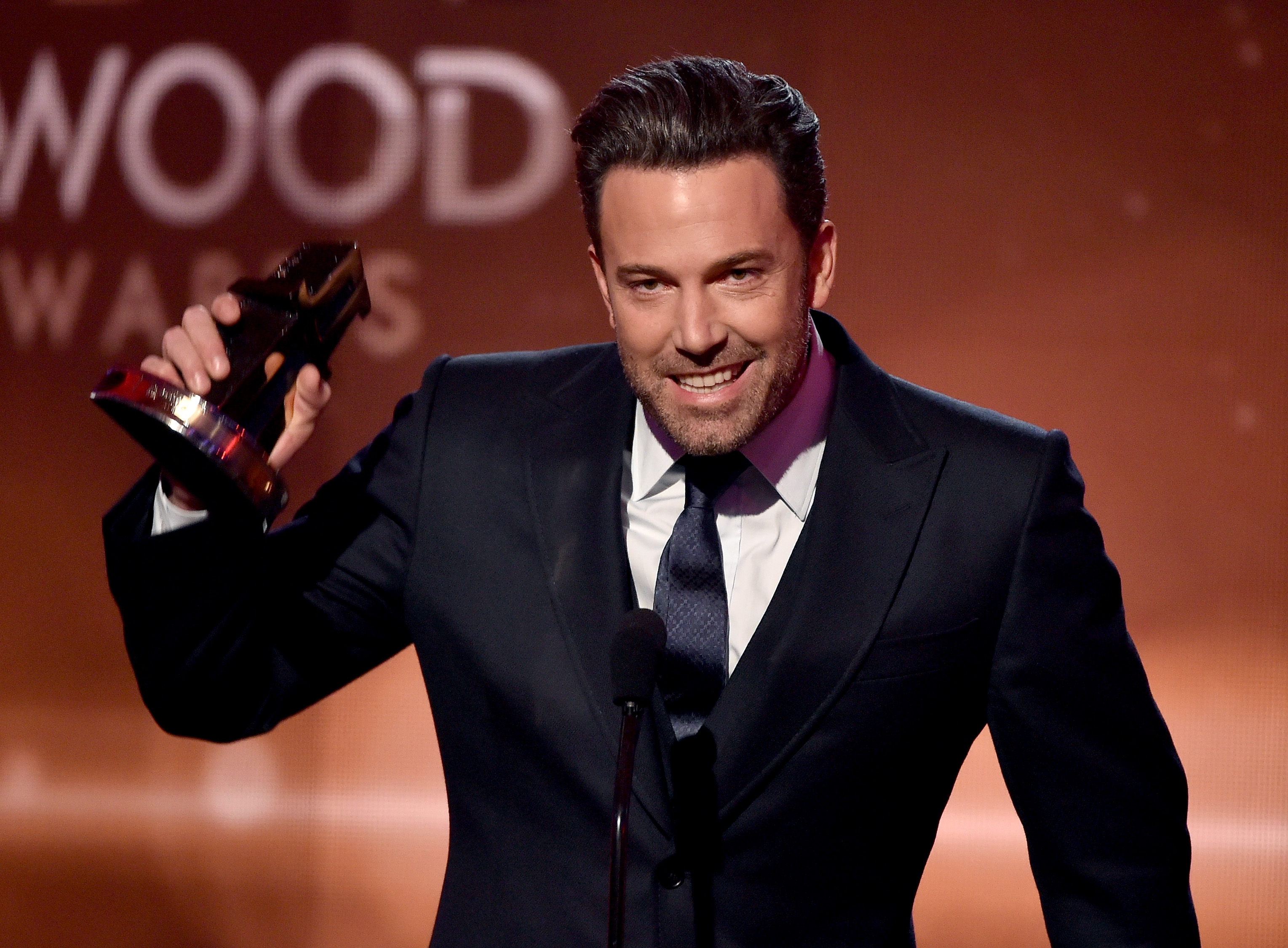 Ben Affleck accepts the Hollywood Film Award for 'Gone Girl' onstage during the 18th Annual Hollywood Film Awards at The Palladium on November 14, 2014 in Hollywood, California.