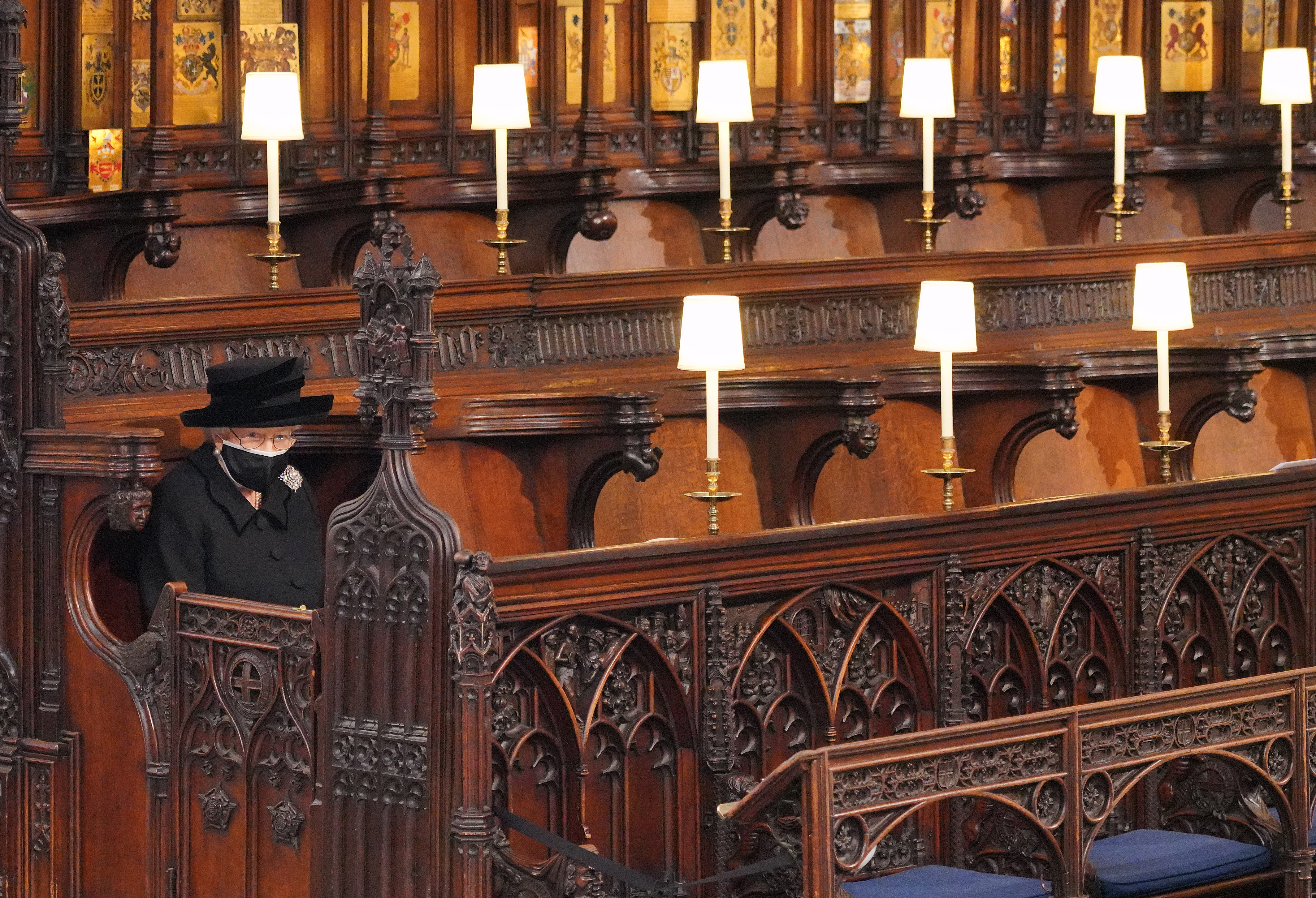 Queen Elizabeth II sitting alone inside St. George's Chapel during the funeral of Prince Philip, Duke of Edinburgh, on April 17, 2021 | Source: Getty Images